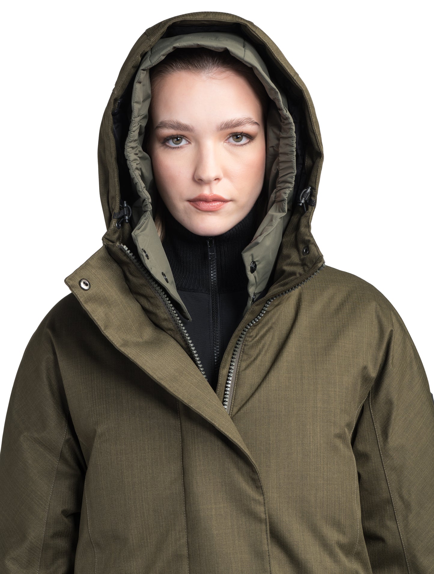 Dory Women's Tailored Back Zip Parka in knee length, premium Crosshatch fabrication, Premium Canadian White Duck Down insulation, non-removable down-filled hood, removable interior hood, centre front two-way zipper with wind flap, vertical zipper detailing along back, in Fatigue