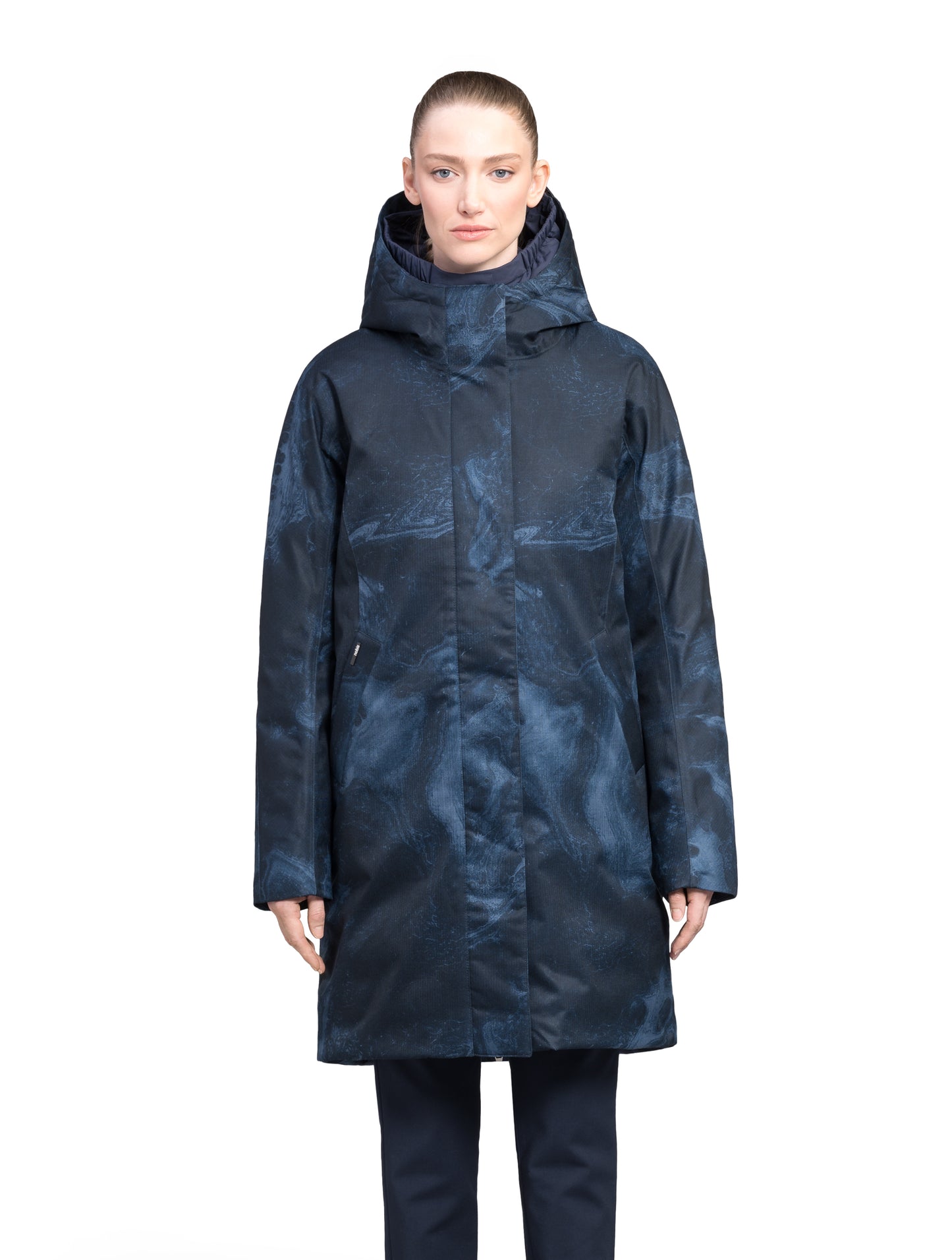 Dory Women's Tailored Back Zip Parka in knee length, premium Crosshatch fabrication, Premium Canadian White Duck Down insulation, non-removable down-filled hood, removable interior hood, centre front two-way zipper with wind flap, vertical zipper detailing along back, in Navy