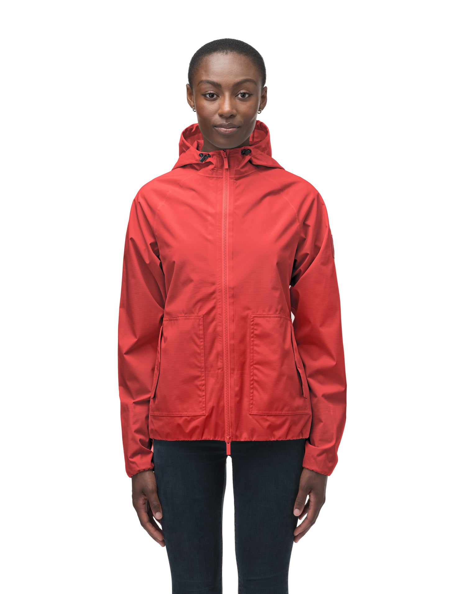 Women's hip length waterproof jacket with non-removable hood and two-way zipper in Vermillion