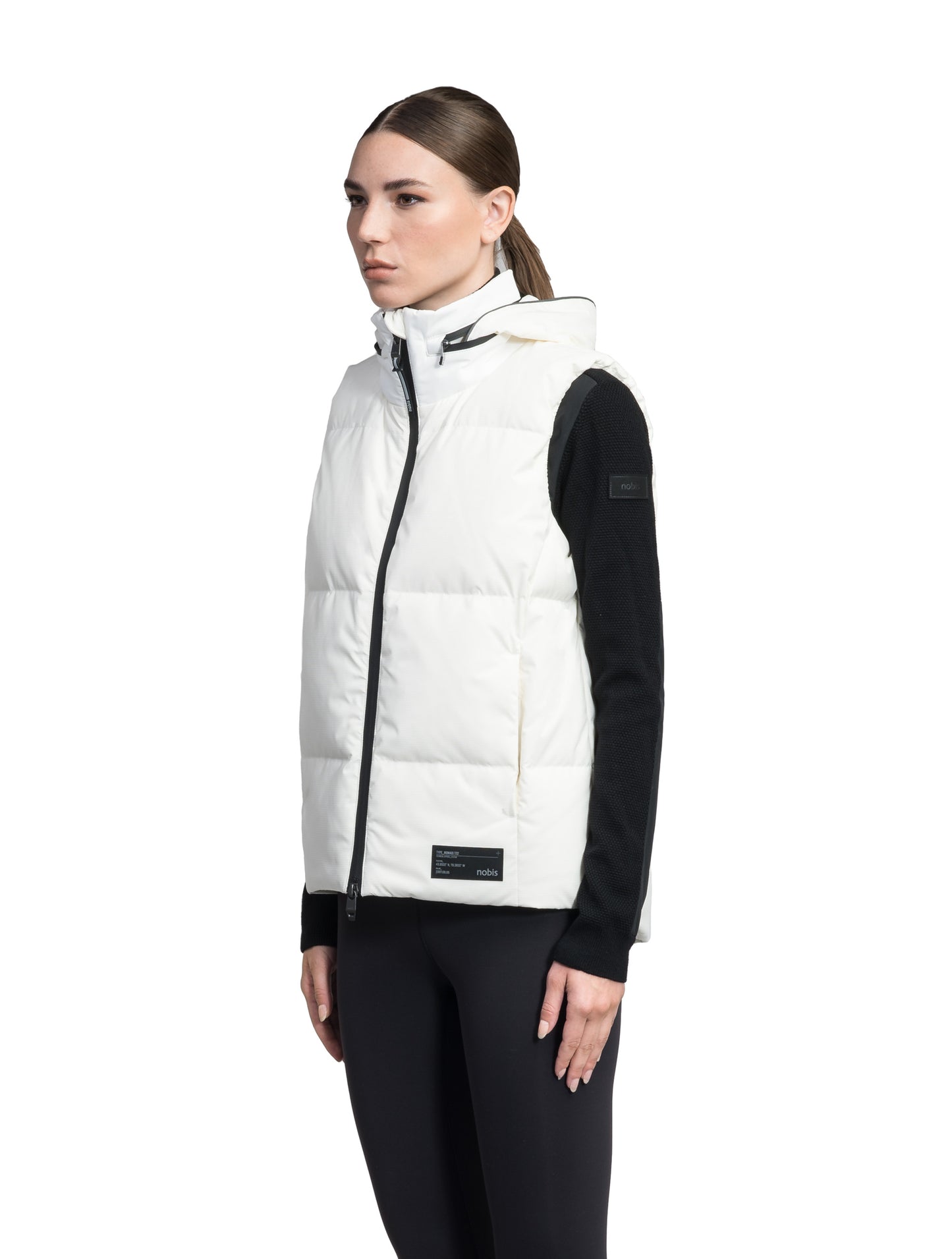 Oren Ladies Performance Vest in hip length, Durable Stretch Ripstop and 3-Ply Micro Denier fabrication, Premium Canadian White Duck Down insulation, tuck-away waterproof hood, and two-way centre front zipper, in Chalk