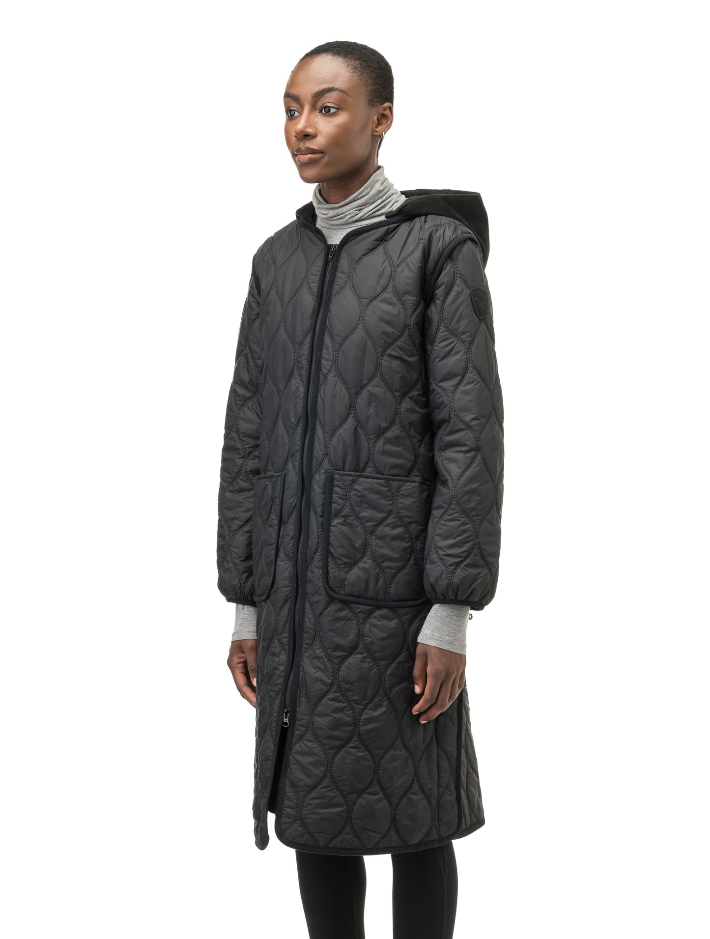 Suri Ladies Long Quilted Jacket in knee length, sustainable and environmentally friendly Primaloft Gold Insulation Active+, with removable fleece hood, two-way front zipper, diamond quilted body, in Black