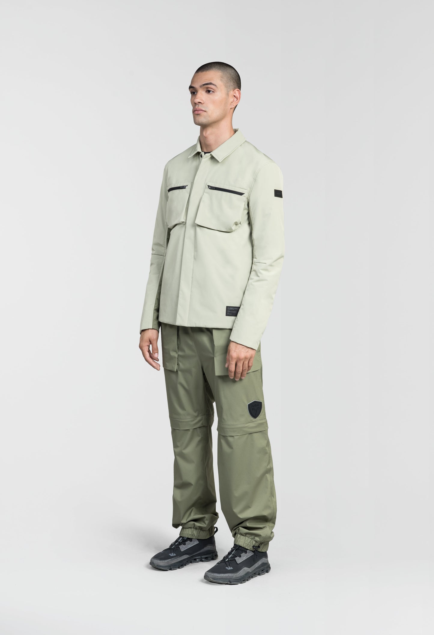 Ander Men's Mid Layer Shirt in hip length, PrimaLoft Gold Insulation Active+, 3-Ply Micro Denier front and 4-Way Durable Stretch Weave back, zipper chest pockets, snap button wind flap, and snap button cuffs, in Tea/Clover