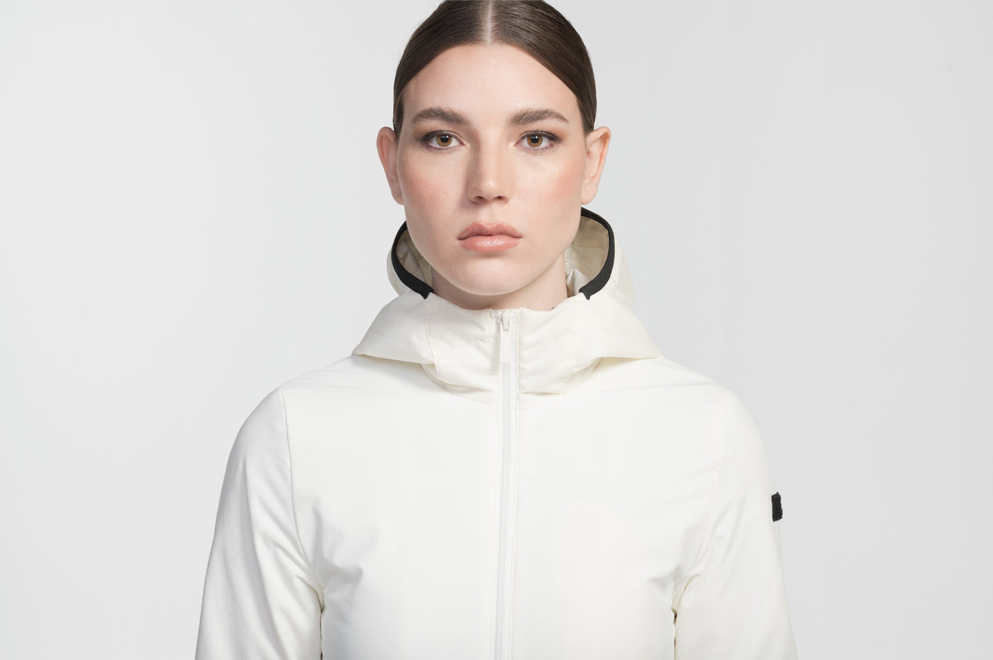 Ladies hip length mid layer jacket with non-removable hood and two-way zipper in Chalk