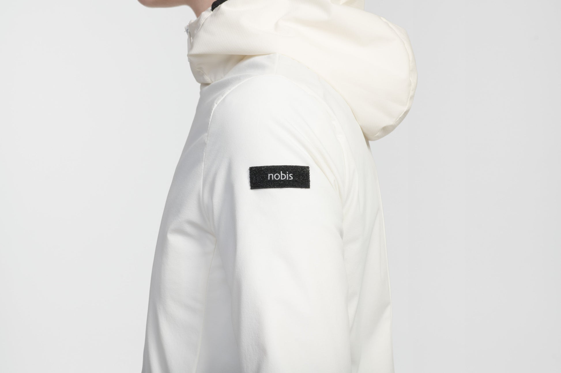 Ladies hip length mid layer jacket with non-removable hood and two-way zipper in Chalk