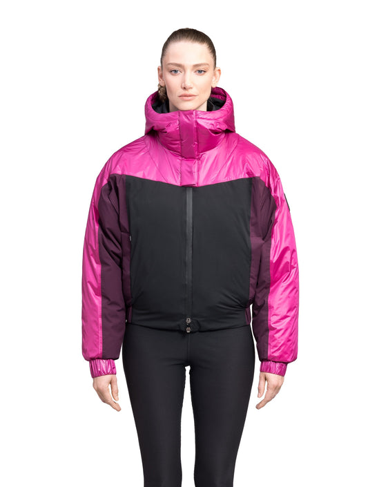 Aspen Women's Batwing Jacket in hip length, premium stretch ripstop and cire technical nylon taffeta fabrication, Premium Canadian White Duck Down insulation, non-removable down-filled hood, centre front two-way zipper, winged arm detailing, in Festival Fushia/Potent Purple + Festival Fushia/Potent Purple