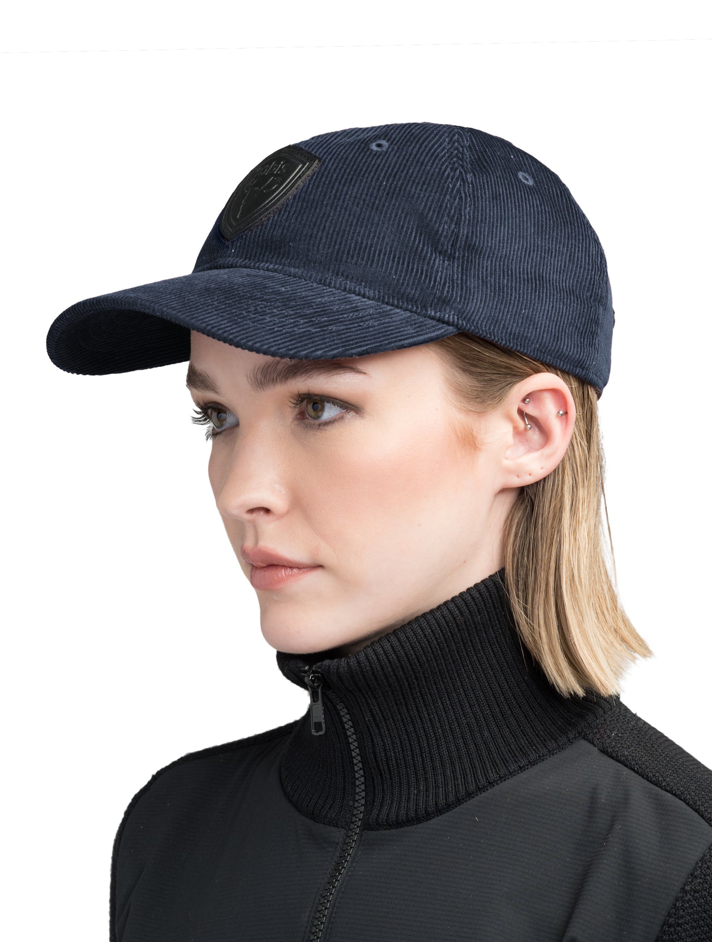 Carter Unisex Tailored Ball Cap in 100% cotton corduroy, unstructured crown, curved brim, and leather strap back with metal buckle closure, in Navy