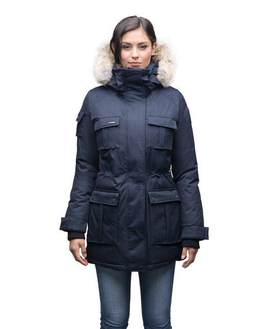 Women's down filled thigh length parka with four pleated patch pockets and an adjustable waist in CH Navy + CH Navy