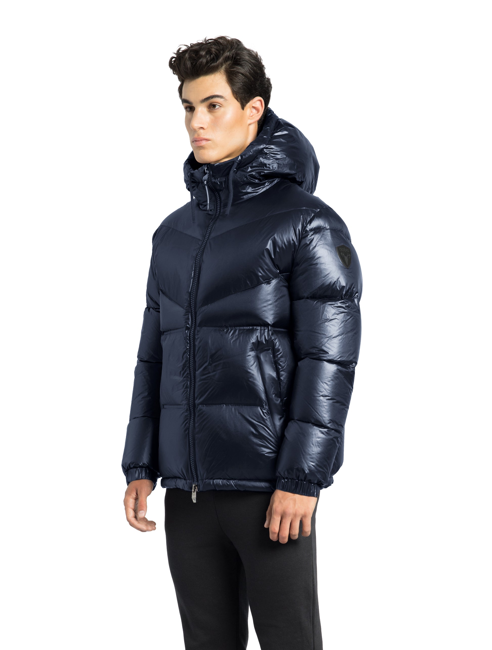 Dyna Men's Chevron Quilted Puffer Jacket in hip length, premium cire technical nylon taffeta fabrication, Premium Canadian origin White Duck Down insulation, non-removable down-filled hood, two-way centre-front zipper, fleece-lined zipper pockets at waist, pit zipper vents, in Navy