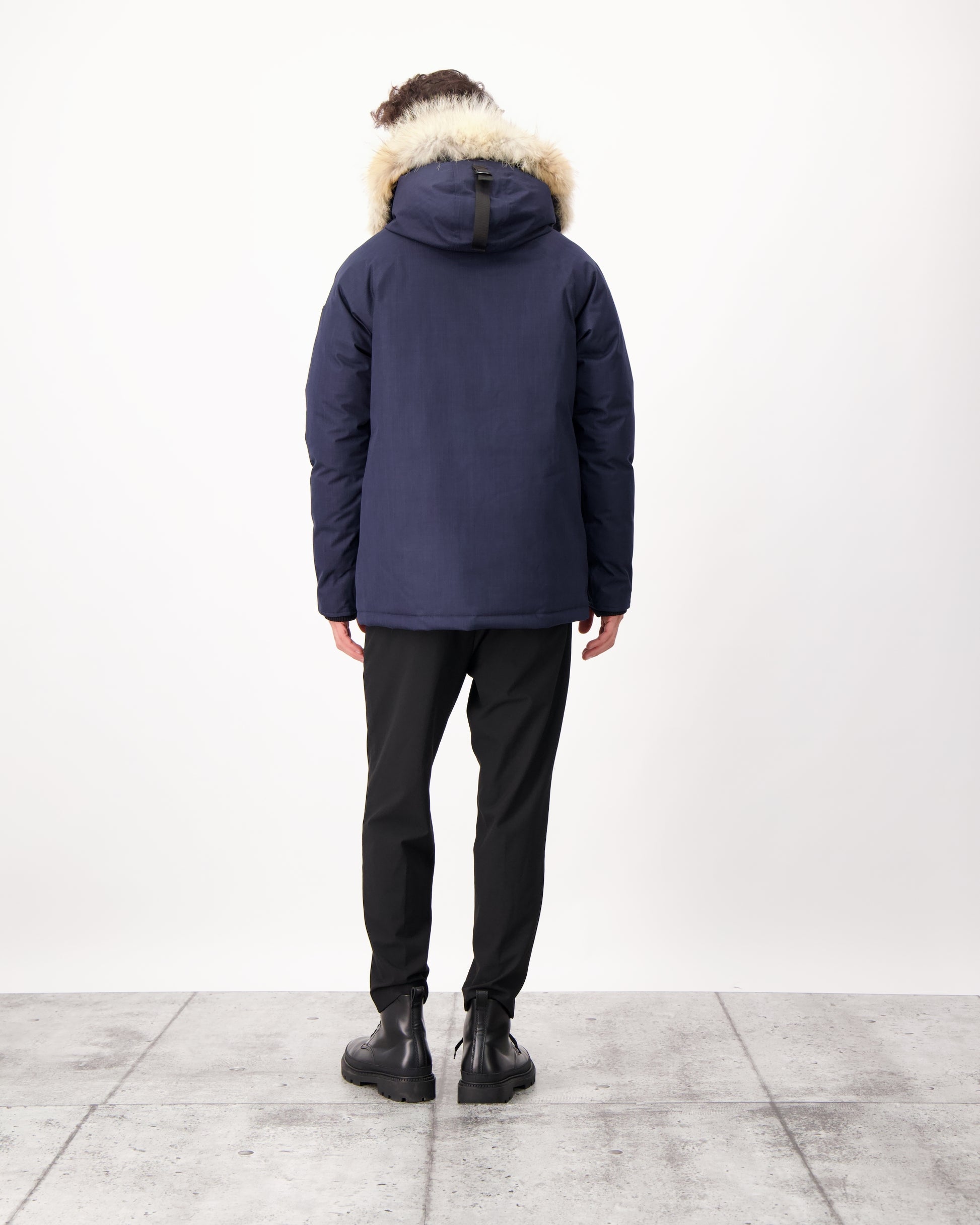 Men's waist length down filled jacket with two front pockets with magnetic closure and a removable fur trim on the hood in CH Navy