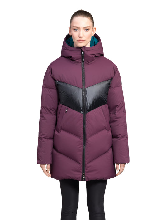 Isla Women's Chevron Quilted Puffer Jacket in thigh length, premium technical nylon taffeta fabrication, Premium Canadian origin White Duck Down insulation, non-removable down-filled hood, two-way centre-front zipper, zipper pockets at waist, contrast cire technical nylon taffeta detailing on chest and back, in Potent Purple
