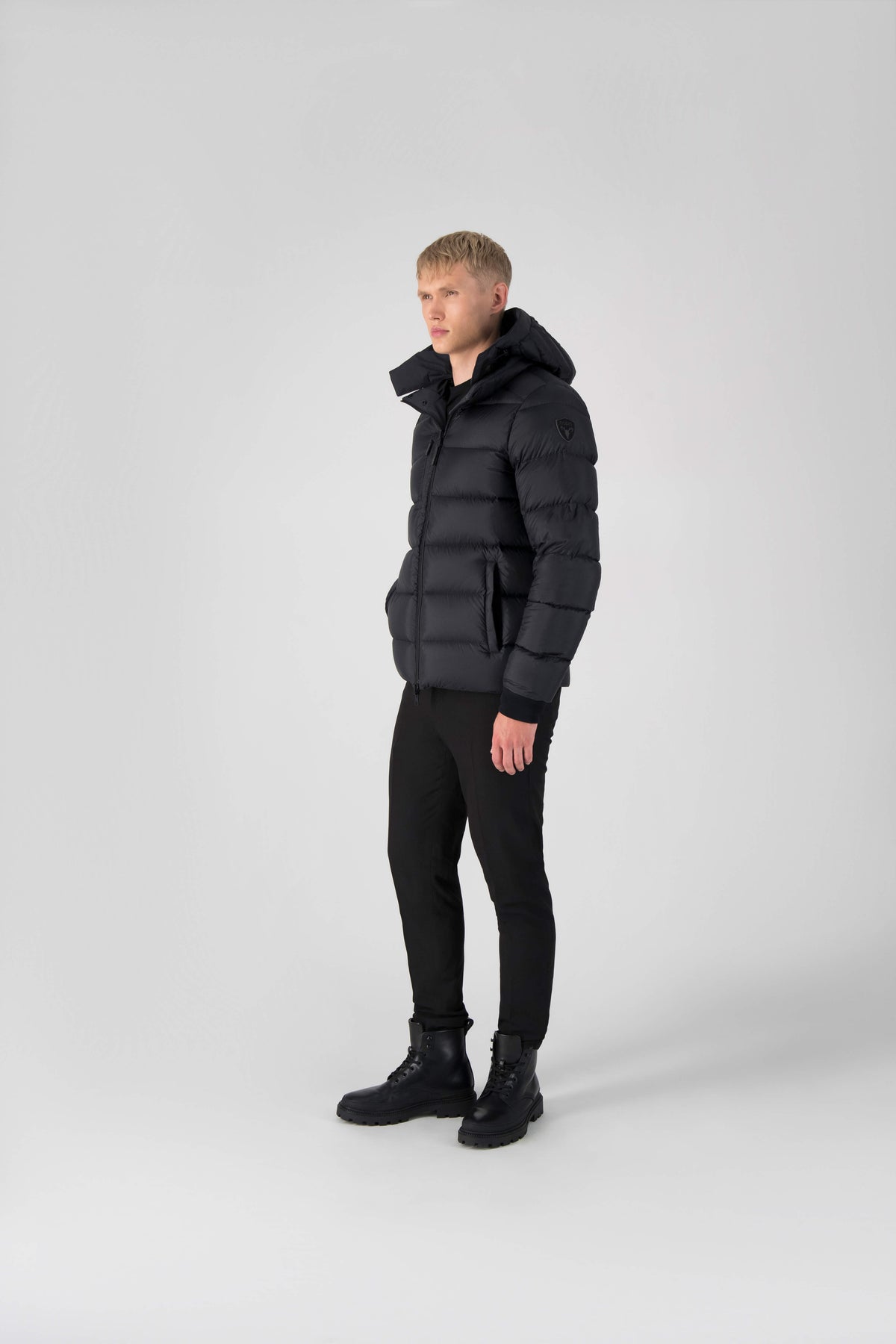 Hip length, reversible men's down filled jacket with removable hood in Black