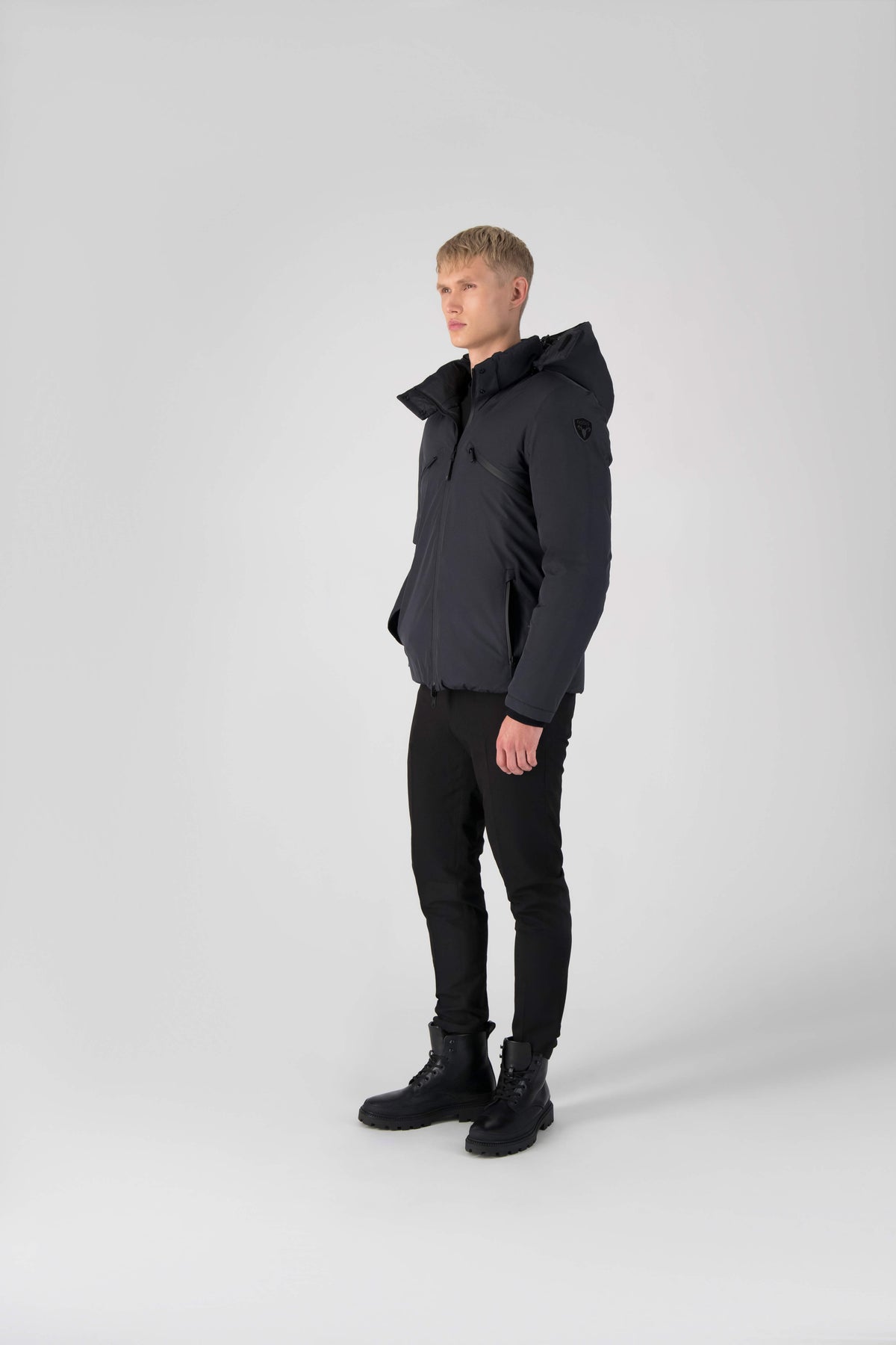 Hip length, reversible men's down filled jacket with removable hood in Black