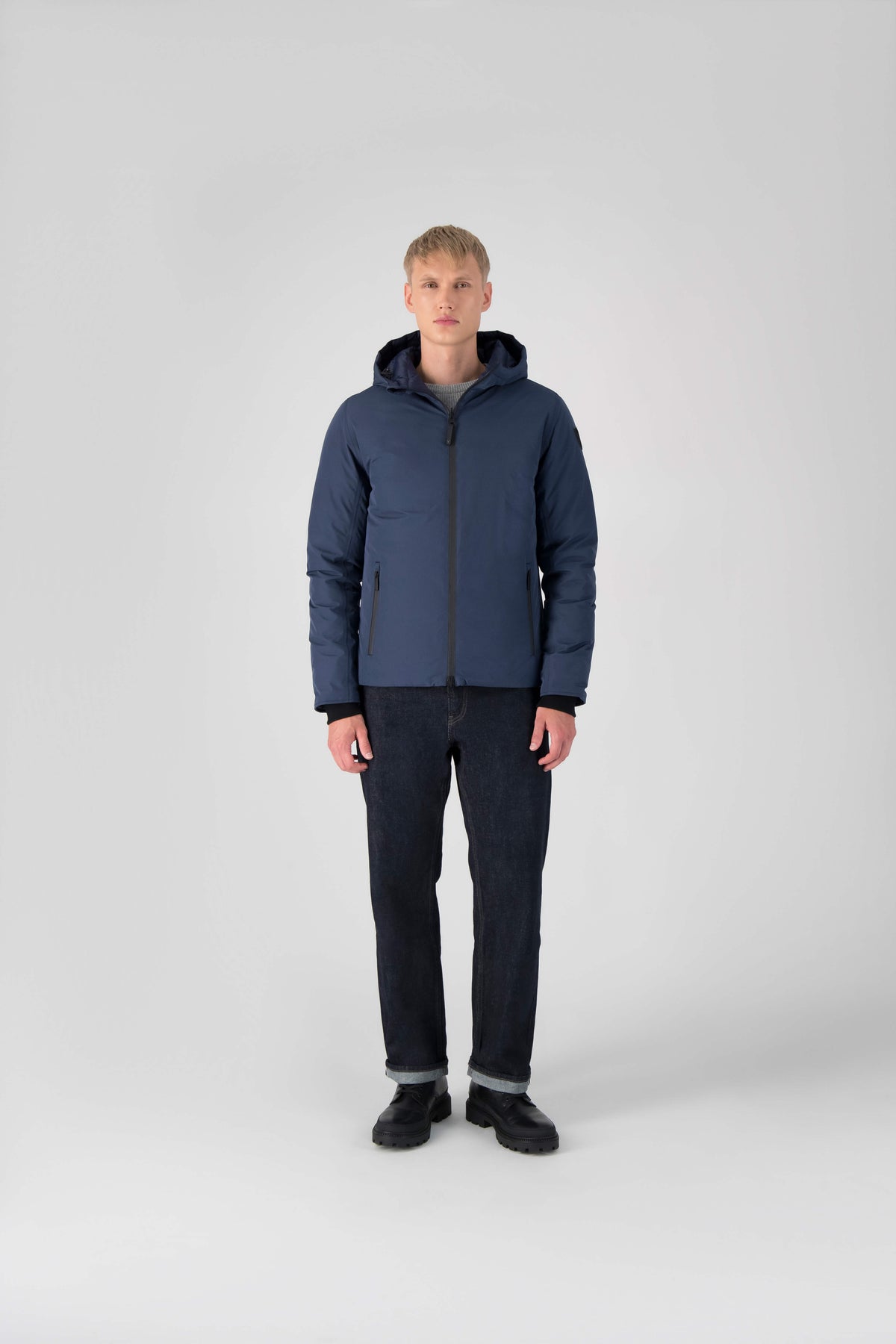 Hip length, reversible men's down filled jacket with removable hood in Marine