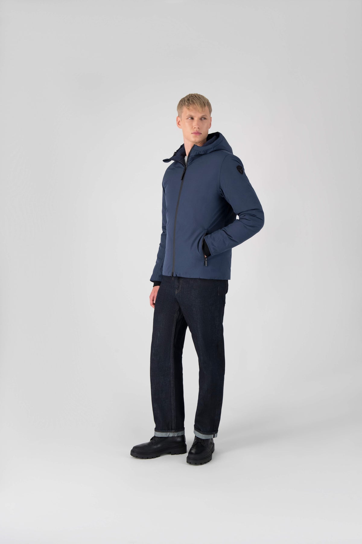 Hip length, reversible men's down filled jacket with removable hood in Marine