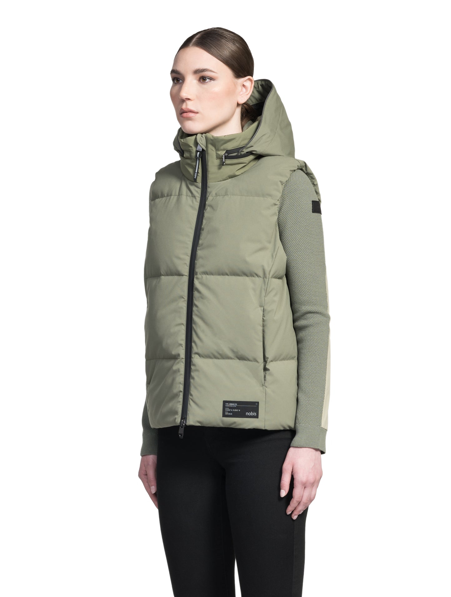 Oren Ladies Performance Vest in hip length, Durable Stretch Ripstop and 3-Ply Micro Denier fabrication, Premium Canadian White Duck Down insulation, tuck-away waterproof hood, and two-way centre front zipper, in Clover