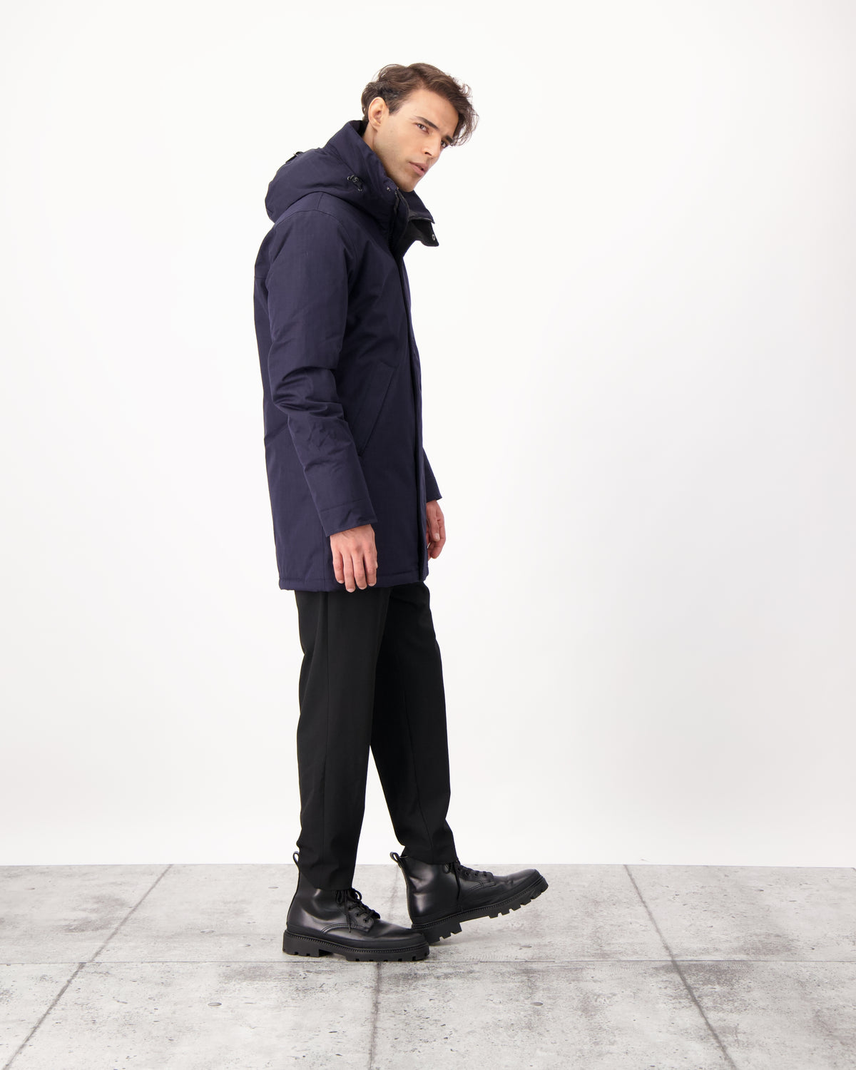 Pierre Men's Jacket in thigh length, Canadian white duck down insulation, non-removable down-filled hood, angled waist pockets, centre-front zipper with wind flap, and elastic ribbed cuffs, in CH Navy