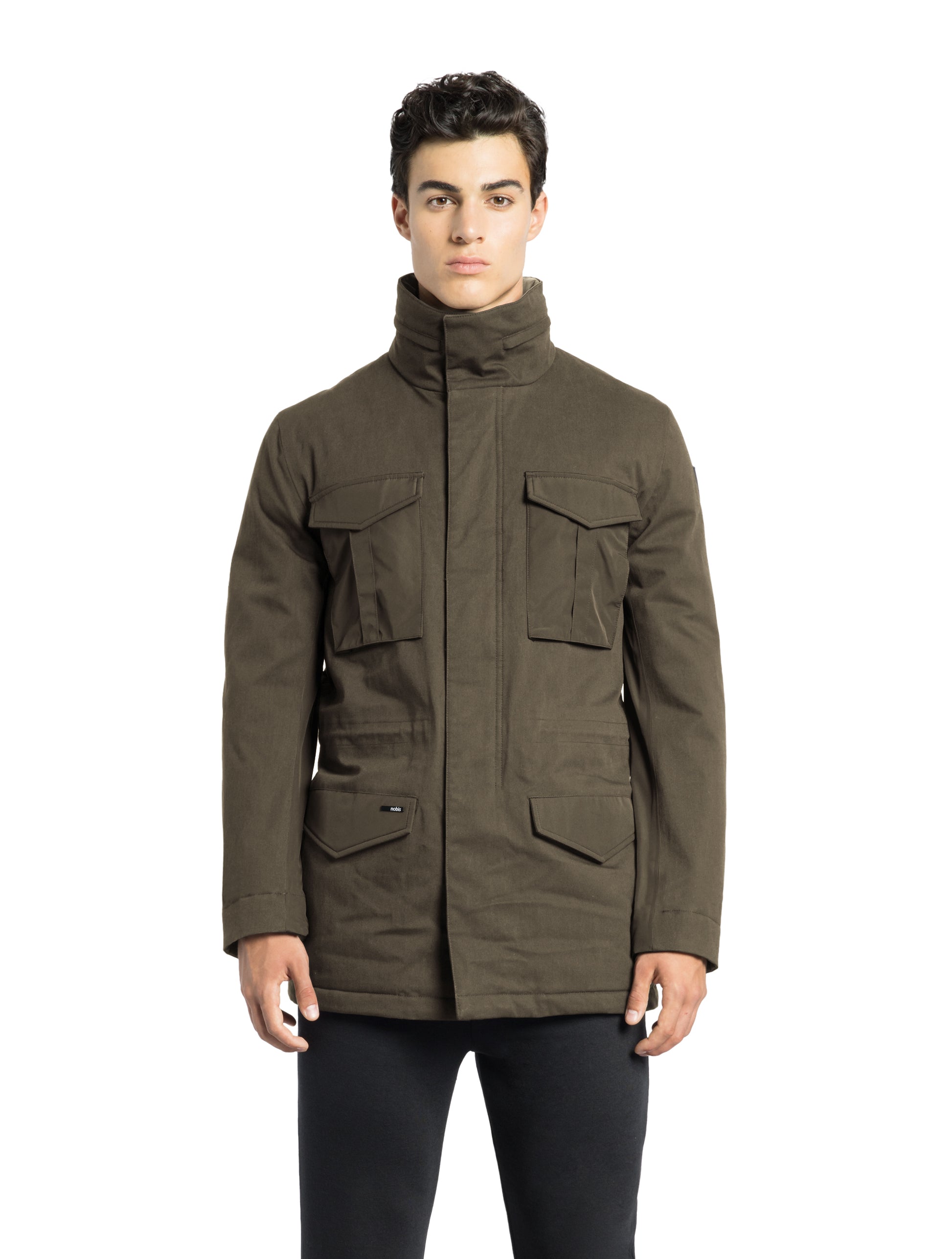 Pelican Men's Tailored Field Jacket in hip length, premium cotton blend and 3-ply micro denier fabrication, Premium Canadian origin White Duck Down insulation, tuck away, waterproof hood in premium cire technical nylon taffeta, two-way centre-front zipper with magnetic wind flap, pit zipper vents, magnetic closure chest and waist flap pockets, hidden adjustable waist drawcord, and action back detailing, in Fatigue