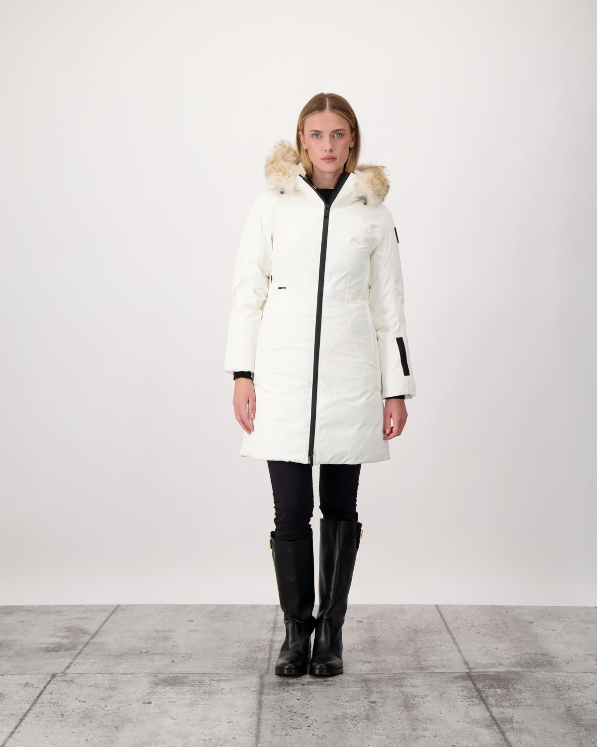 Ladies thigh length down-filled parka with non-removable hood and removable coyote fur trim in Chalk