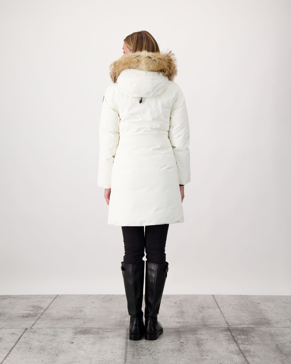 Ladies thigh length down-filled parka with non-removable hood and removable coyote fur trim in Chalk