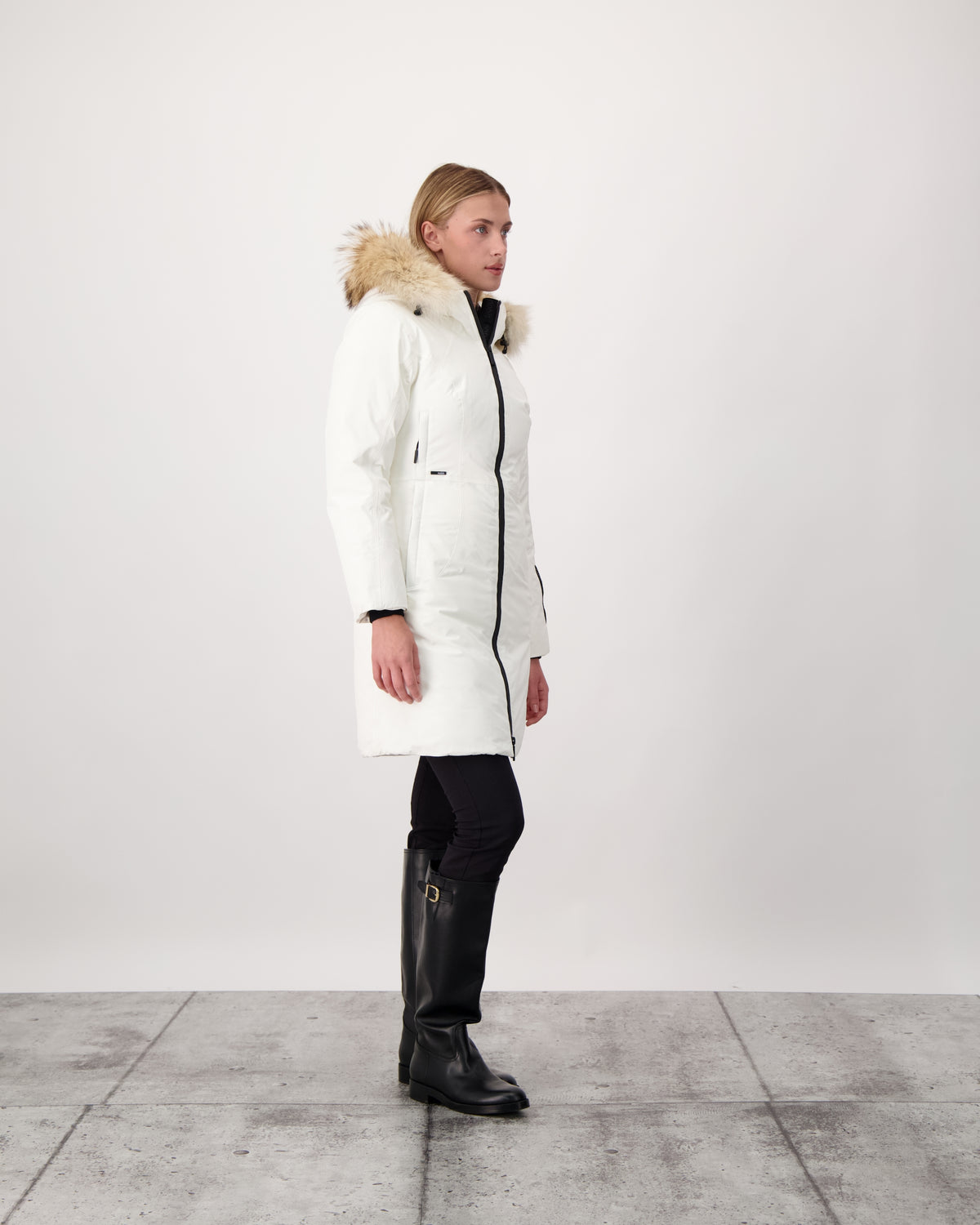 Ladies thigh length down-filled parka with non-removable hood and removable coyote fur trim in Chalk