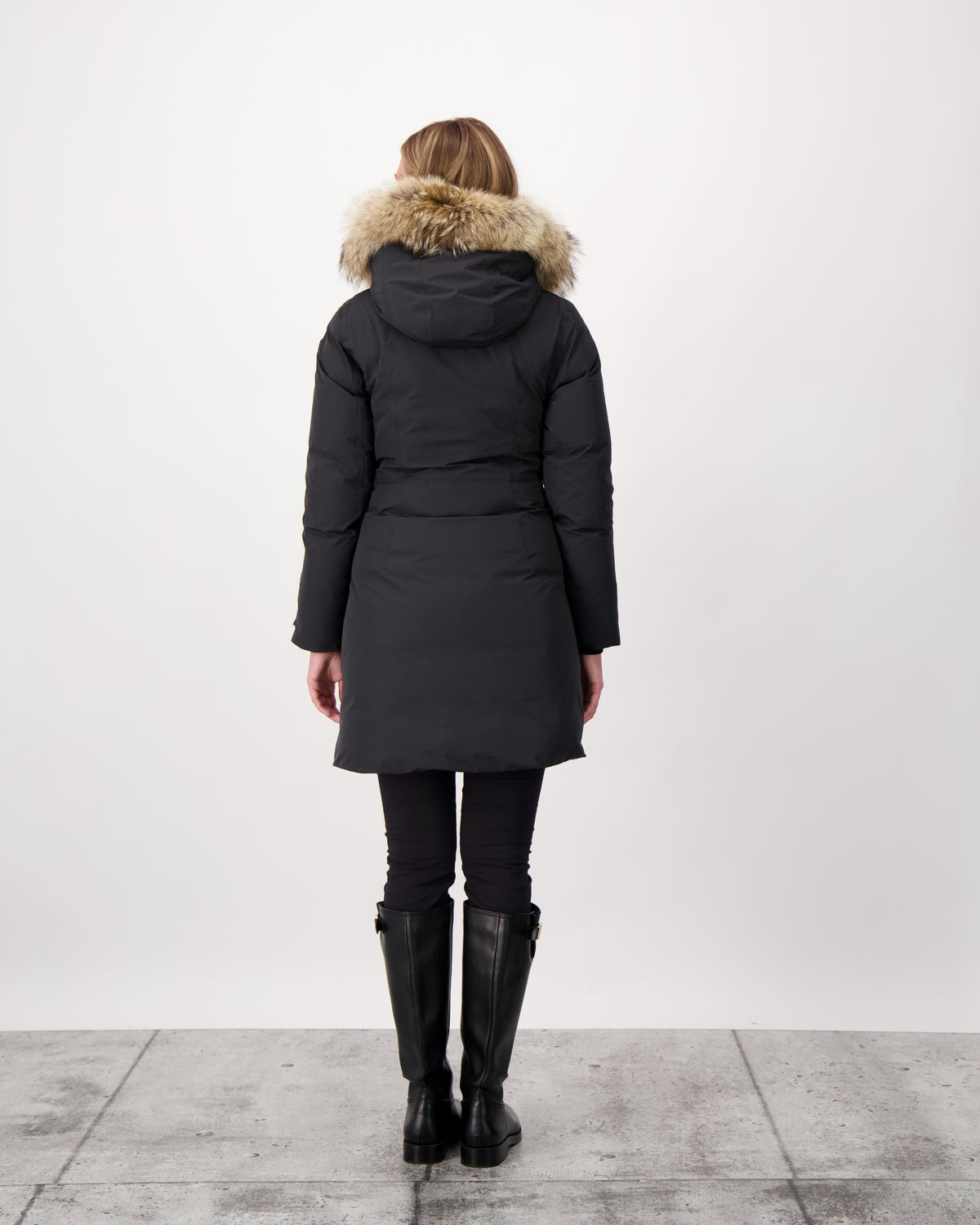 Ladies thigh length down-filled parka with non-removable hood and removable coyote fur trim in Black
