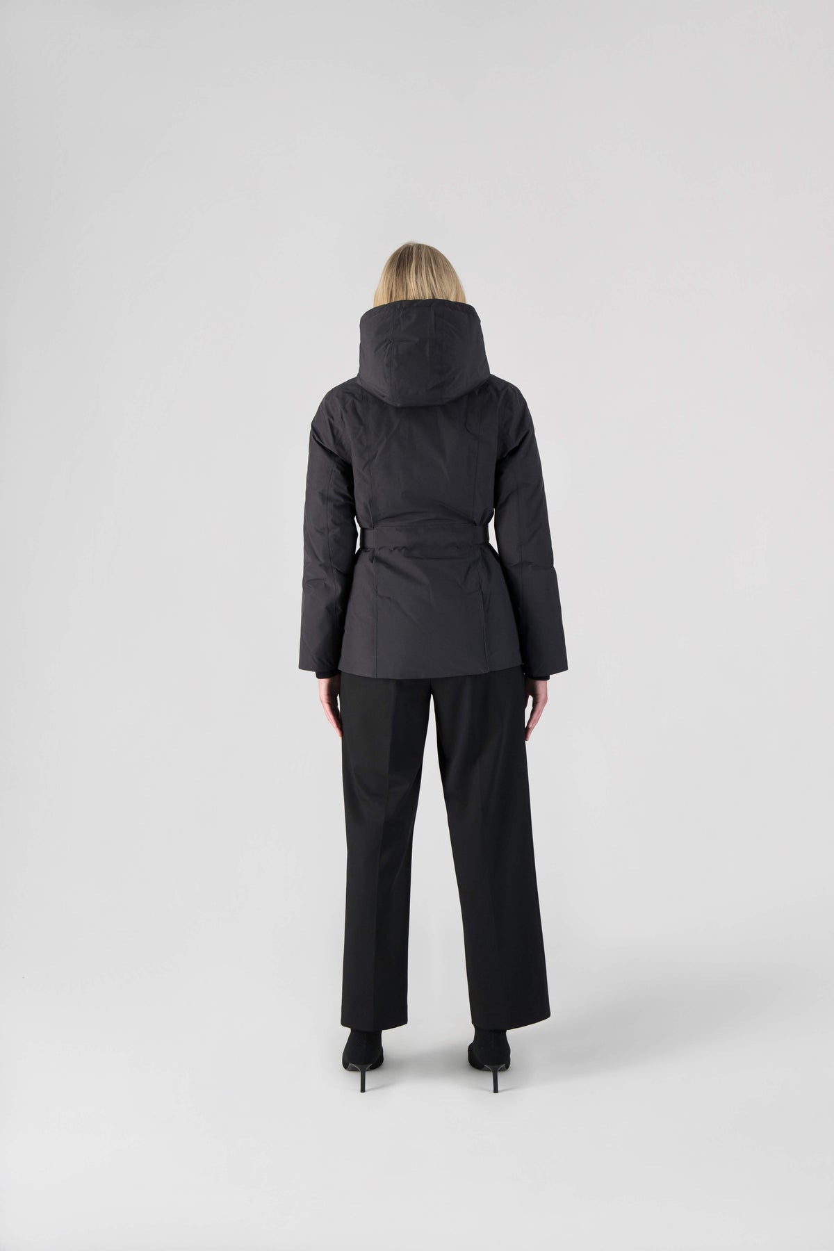 Ladies hip length down-filled parka with non-removable hood and adjustable belt in Black