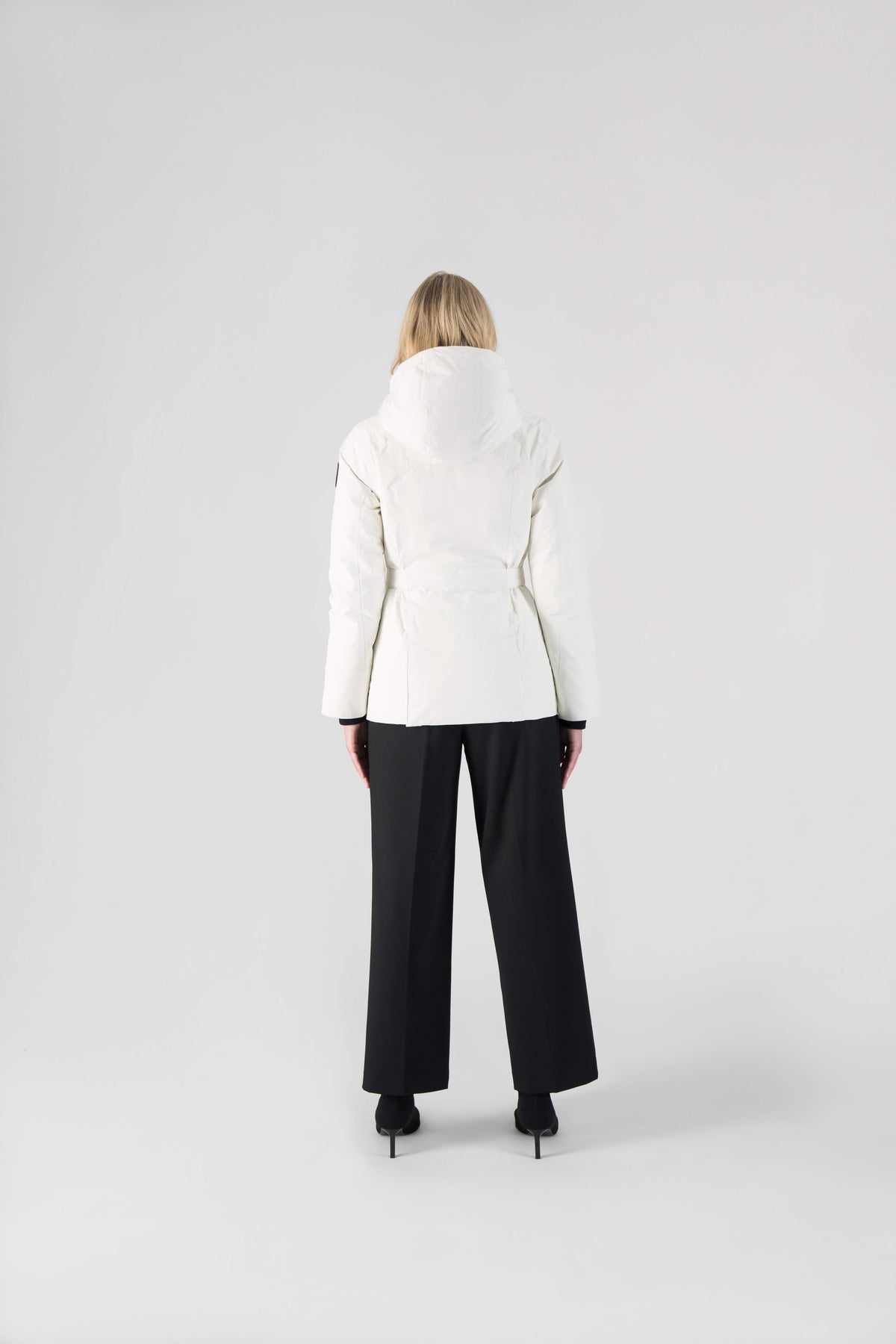 Ladies hip length down-filled parka with non-removable hood and adjustable belt in Chalk