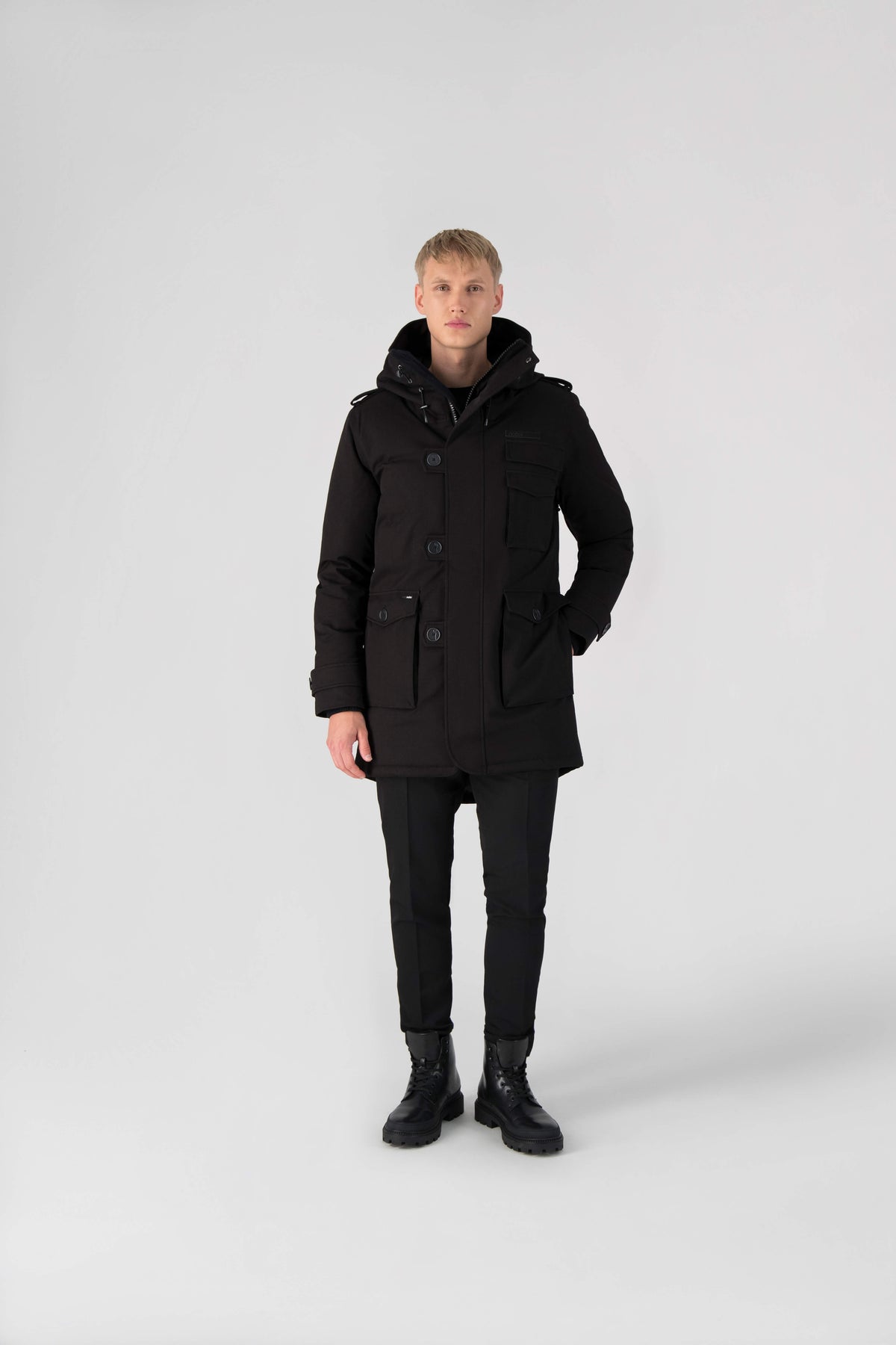 Men's down filled parka with faux button magnet closures and fur free hood with a fishtail hemline in Black