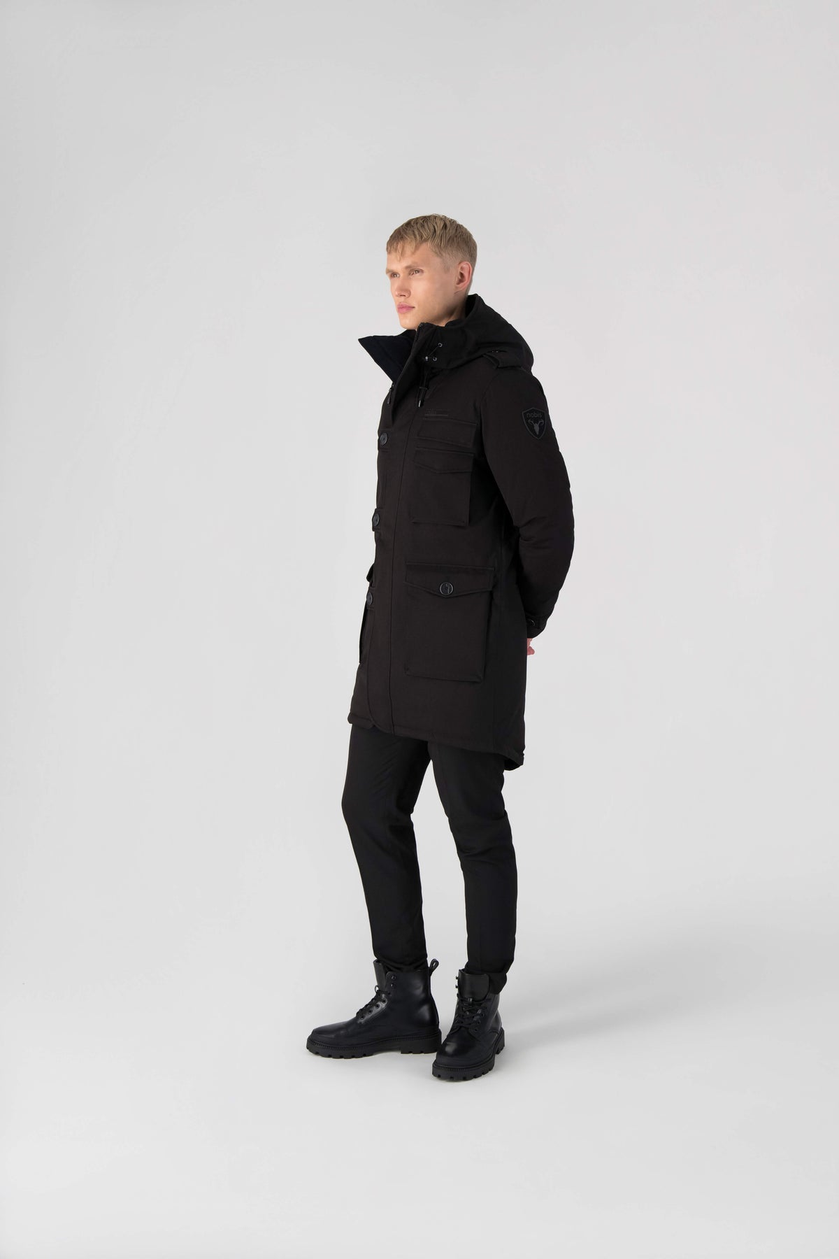 Men's down filled parka with faux button magnet closures and fur free hood with a fishtail hemline in Black