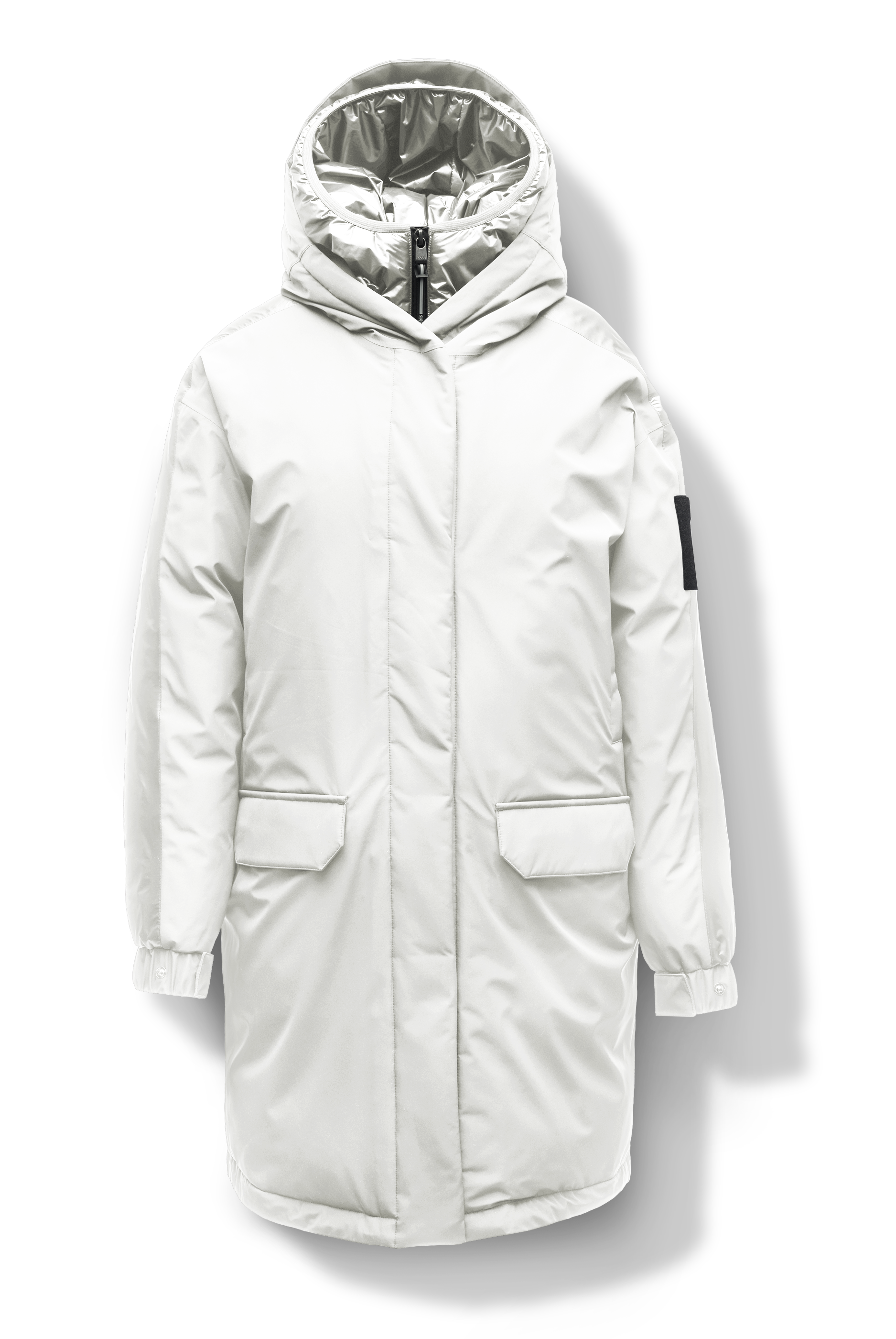 Slyn Women's Performance Parka in thigh length, premium 3-ply micro denier and cire technical nylon taffeta fabrication, Premium Canadian origin White Duck Down insulation, non-removable down-filled hood, inner hooded gilet, two-way centre-front zipper with magnetic closure wind flap, fleece-lined pockets at chest and waist, pit zipper vents, in Chalk