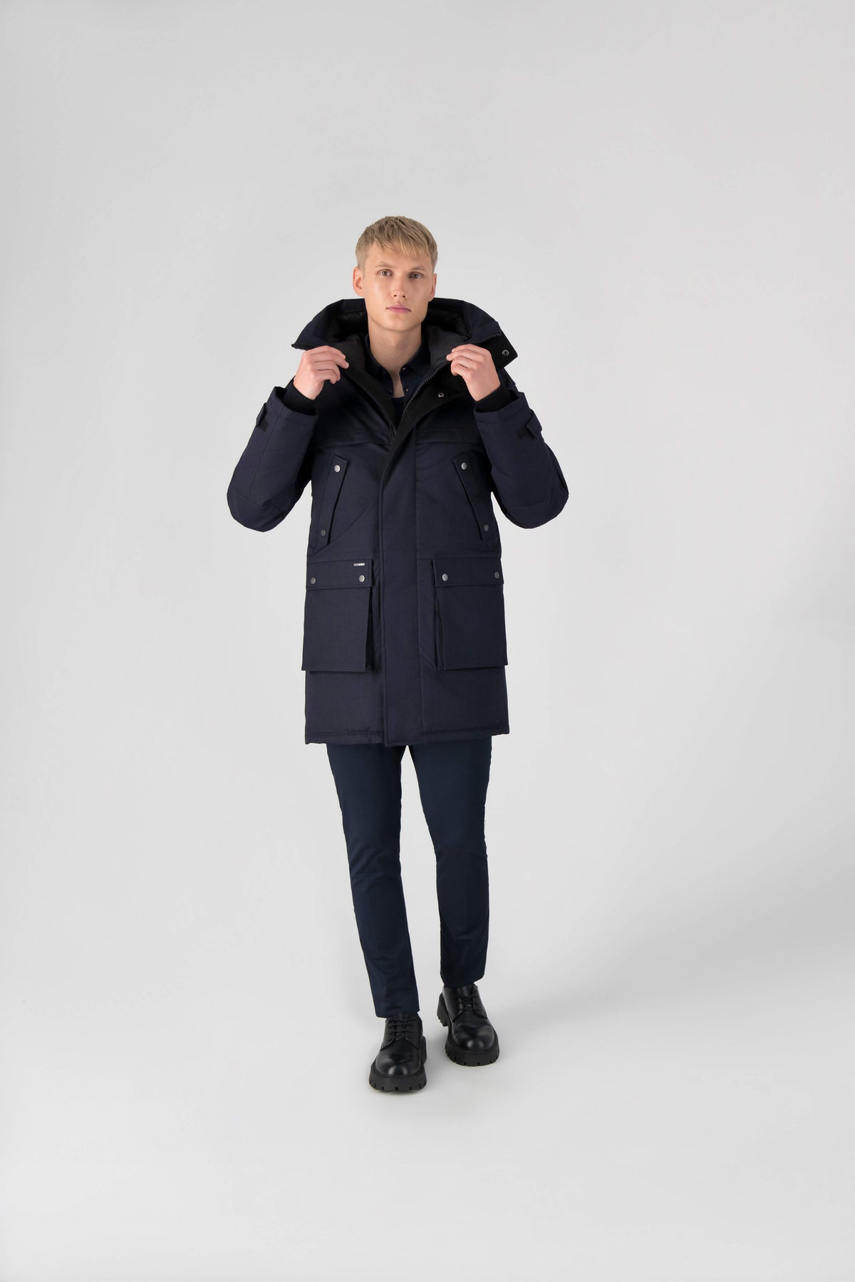 Men's Best Selling Parka the Yatesy is a down filled jacket with a zipper closure and magnetic placket in Navy