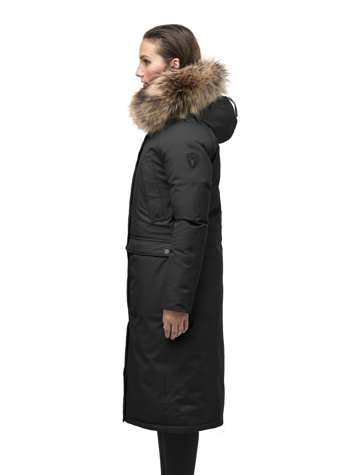 Ladies knee length down-filled parka with four exterior pockets, and a non-removable hood with detachable fur trim in Black