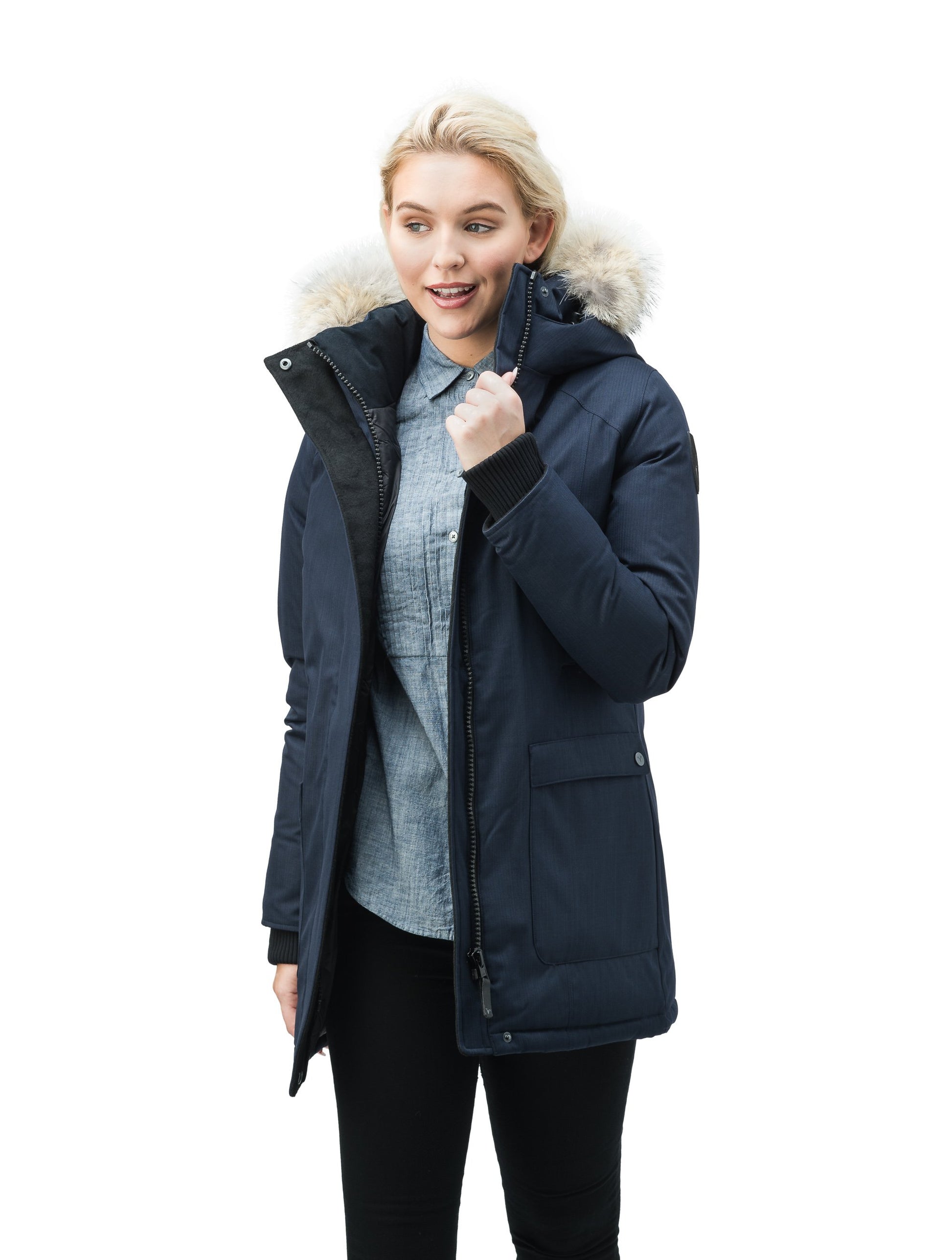 Women's down filled parka that sits just below the hip with a clean look and two hip patch pockets in CH Navy