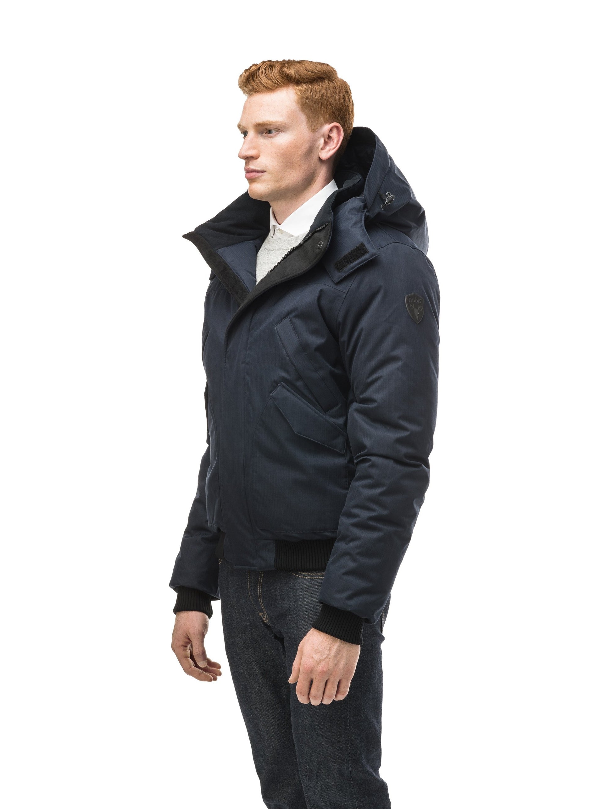 Men's classic down filled bomber jacket with a down filledÂ hood that features a removable coyote fur trim and concealed moldable framing wire in Navy