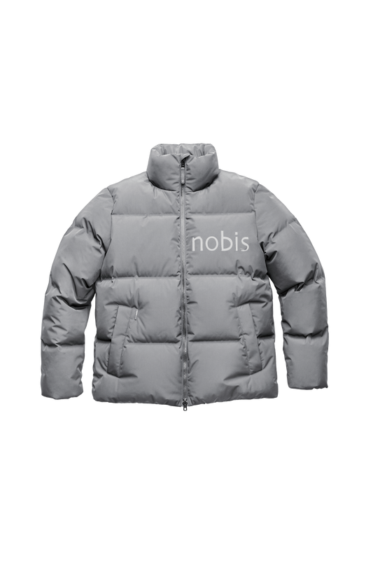 Men's puffer jacket with a minimalist modern design; featuring graphic details like oversized tonal branding, an exposed zipper, and seamless puffer channels in Concrete