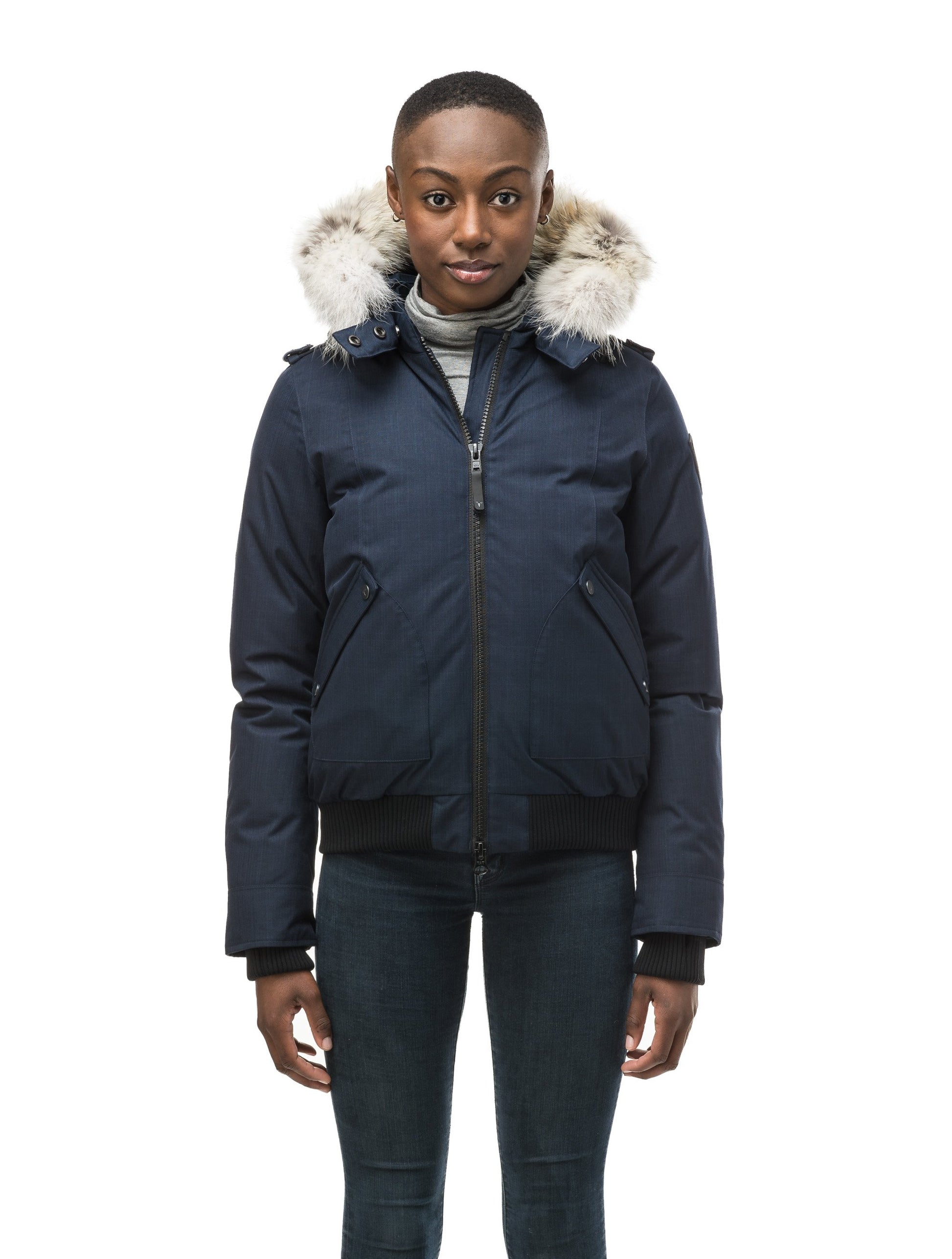 Women's bomber style down filled jacket with a removable hood and fur trim in CH Navy