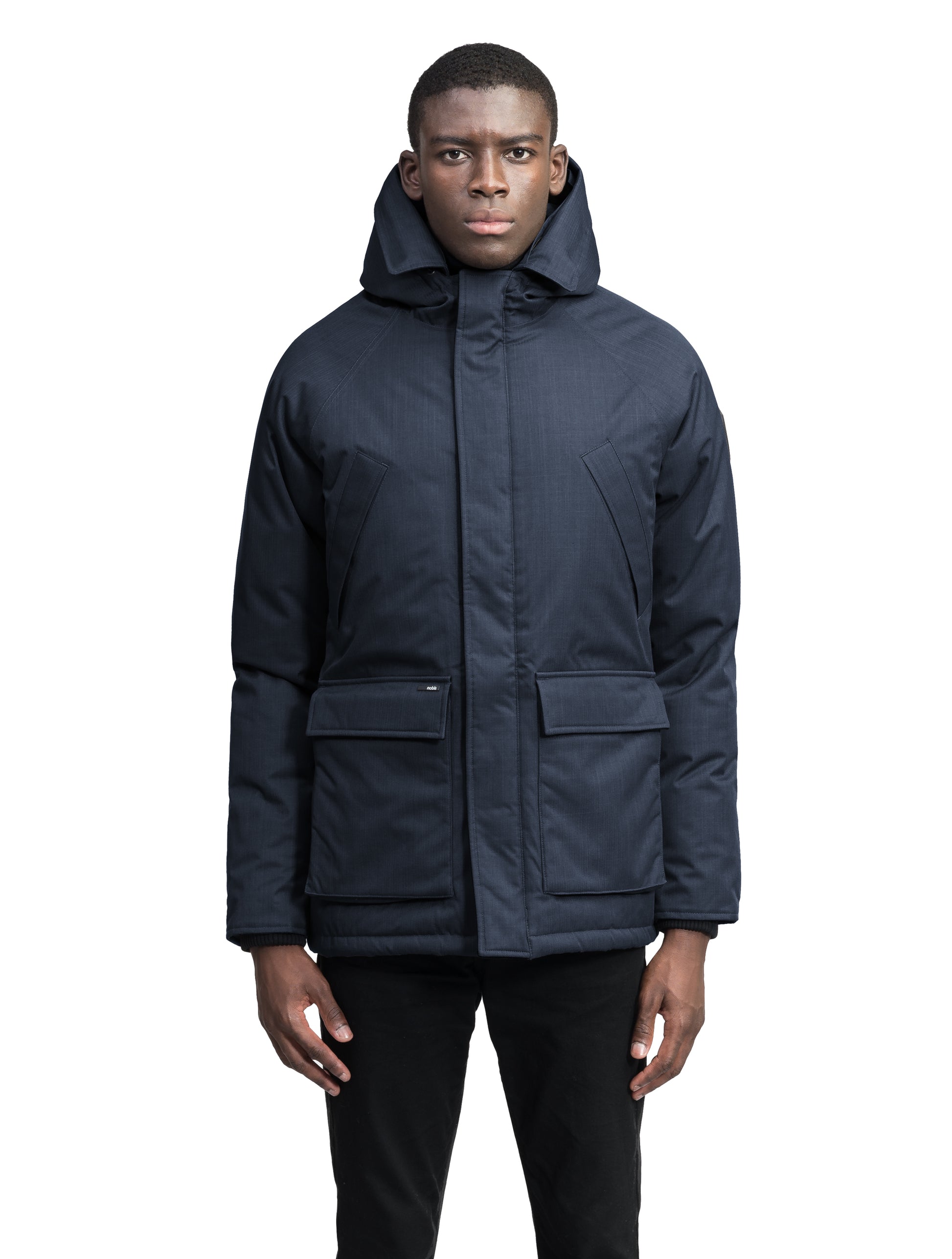 Heritage Furless Men's Parka in hip length, Canadian white duck down insulation, non-removable hood, front zipper with magnetic placket, chest hand warmer pockets, waist flap pockets, and elastic cuffs, in Navy