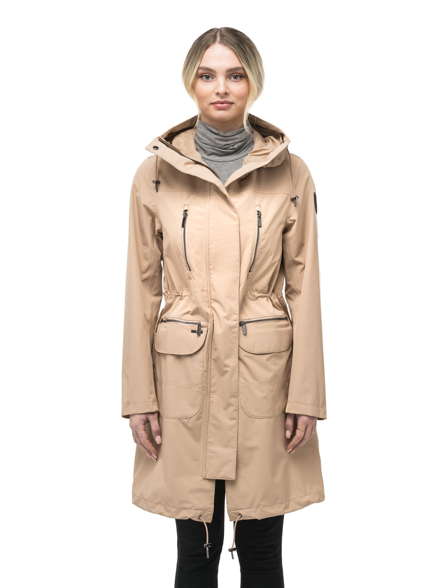 Women's knee length anorak with four front pockets and adjustable cord waist in Fawn