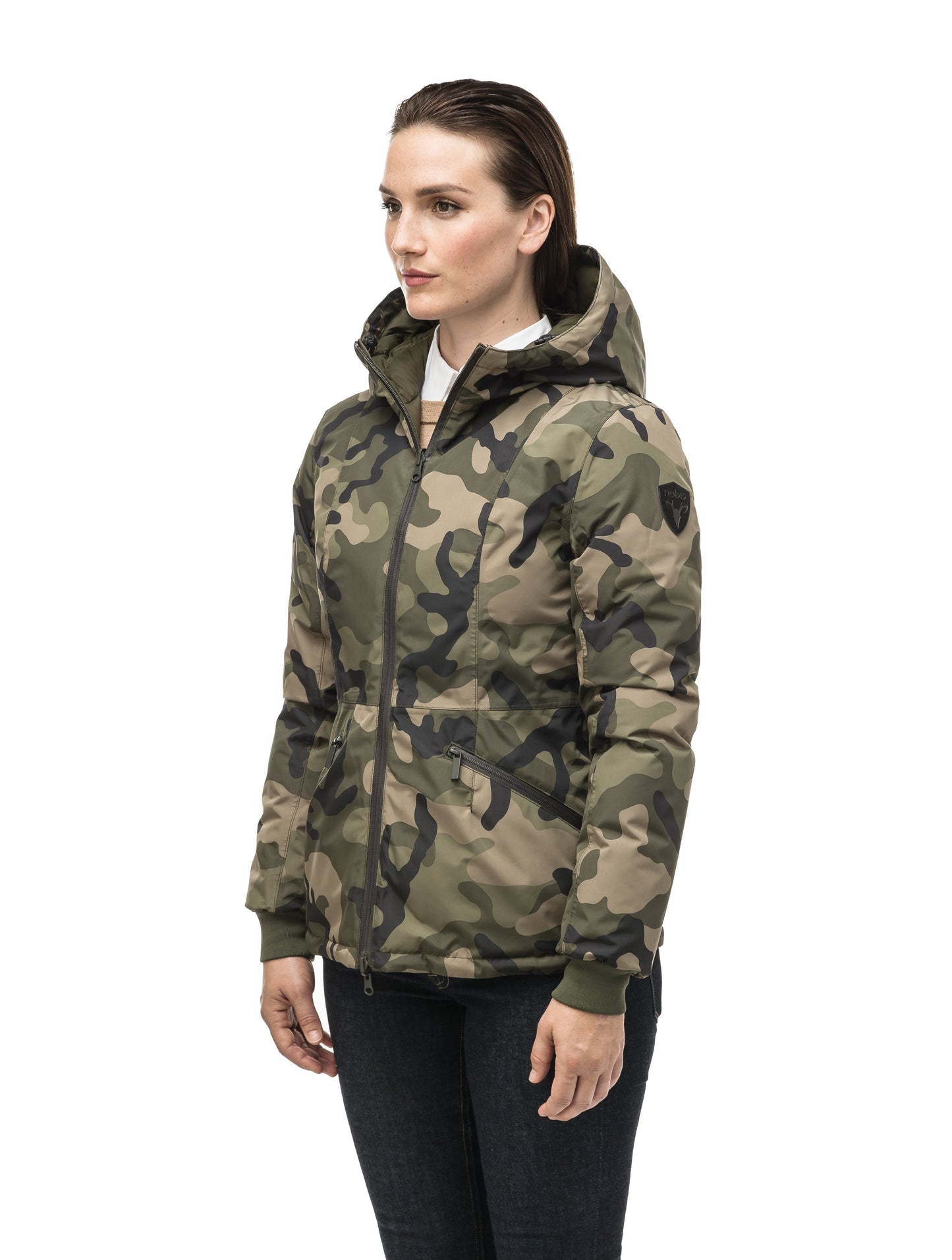 A women's two in one reversible hip length down jacket, one side is quilted and one side is solid waterproof fabric in Camo