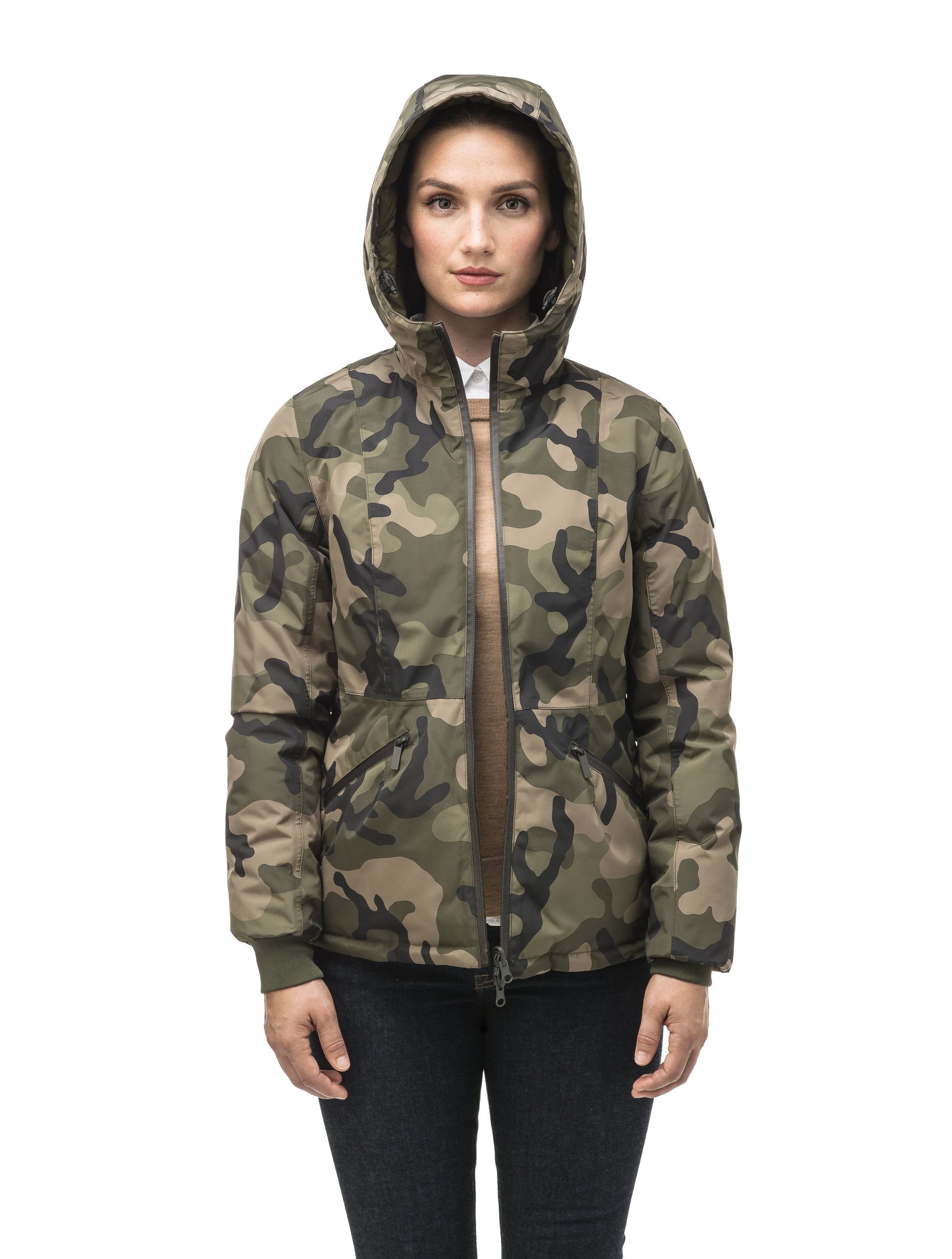 A women's two in one reversible hip length down jacket, one side is quilted and one side is solid waterproof fabric in Camo