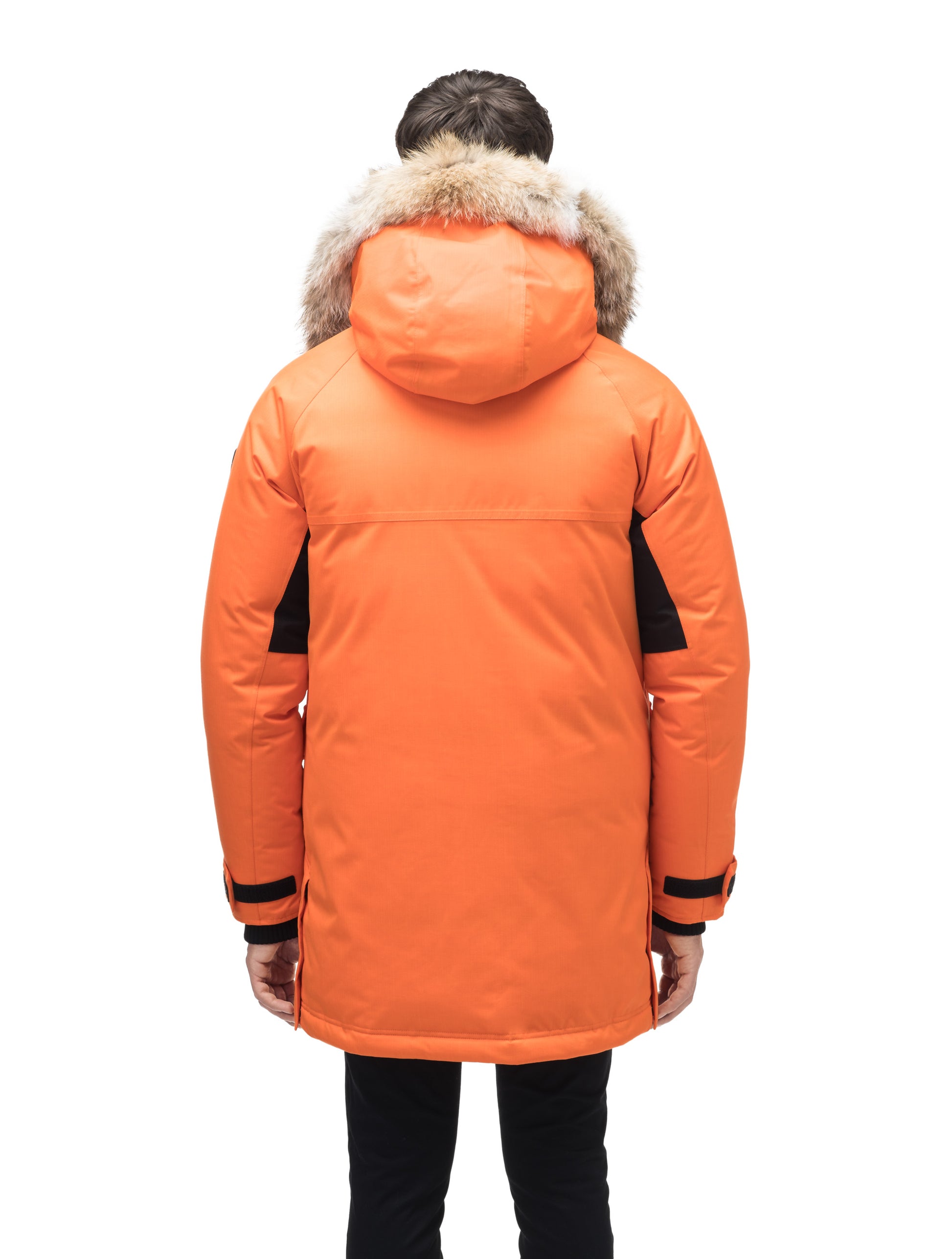 Men's thigh length down-filled parka with removable hood and removable coyote fur trim in Atomic