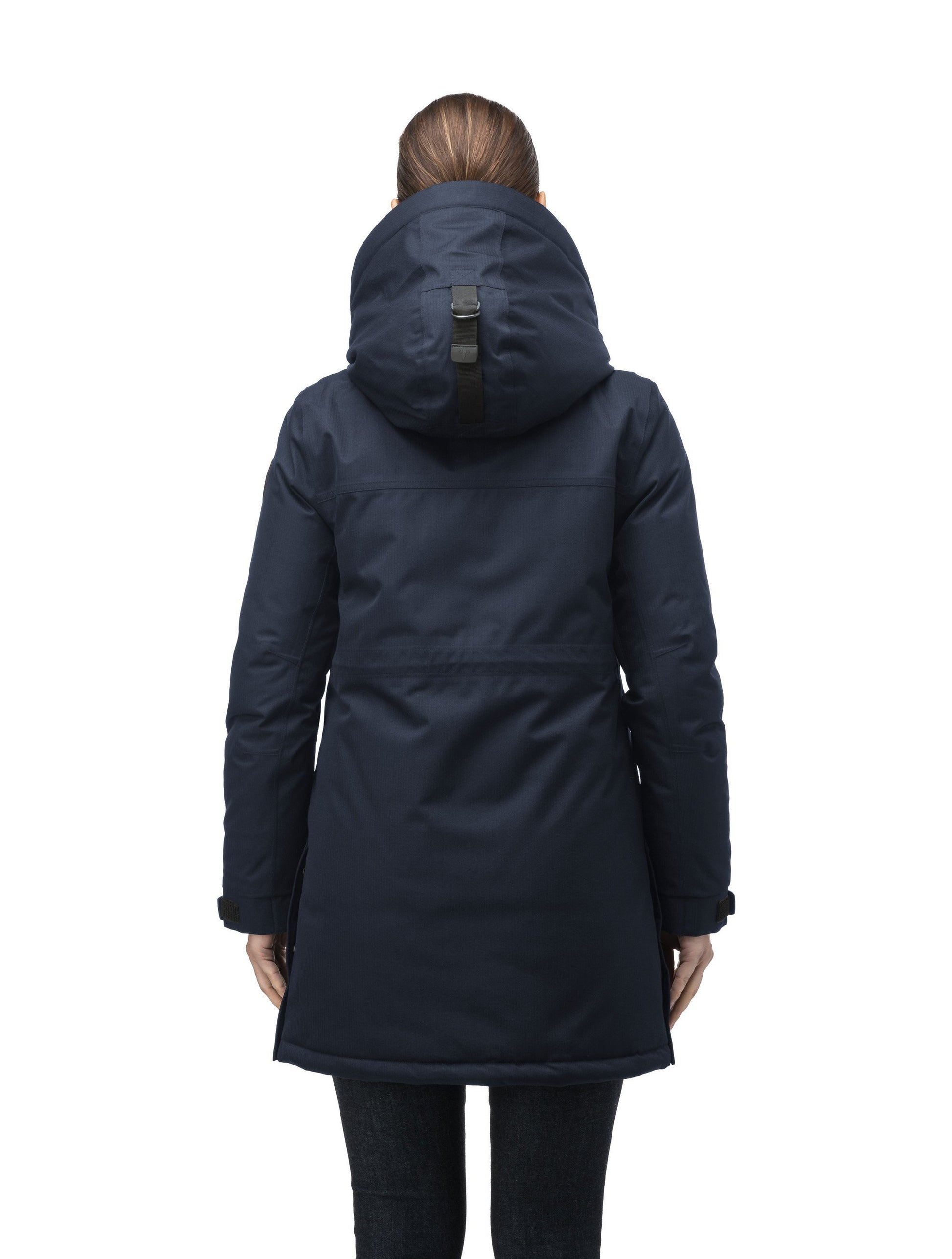 Thigh length women's down filled parka with side entry pockets and drawcord waist, removable hood and fur trim in Navy
