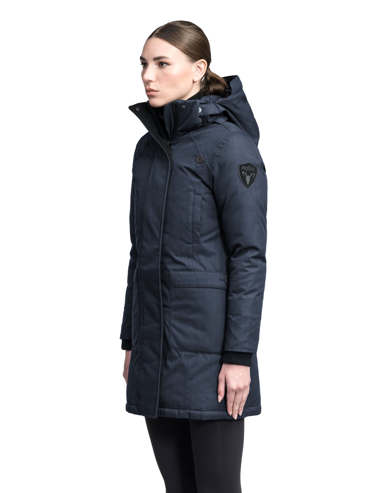 Merideth Furless Ladies Parka in thigh length, Canadian white duck down insulation, removable down-filled hood, centre-front two-way zipper with magnetic wind flap closure, four exterior pockets, and elastic ribbed cuffs, in Navy