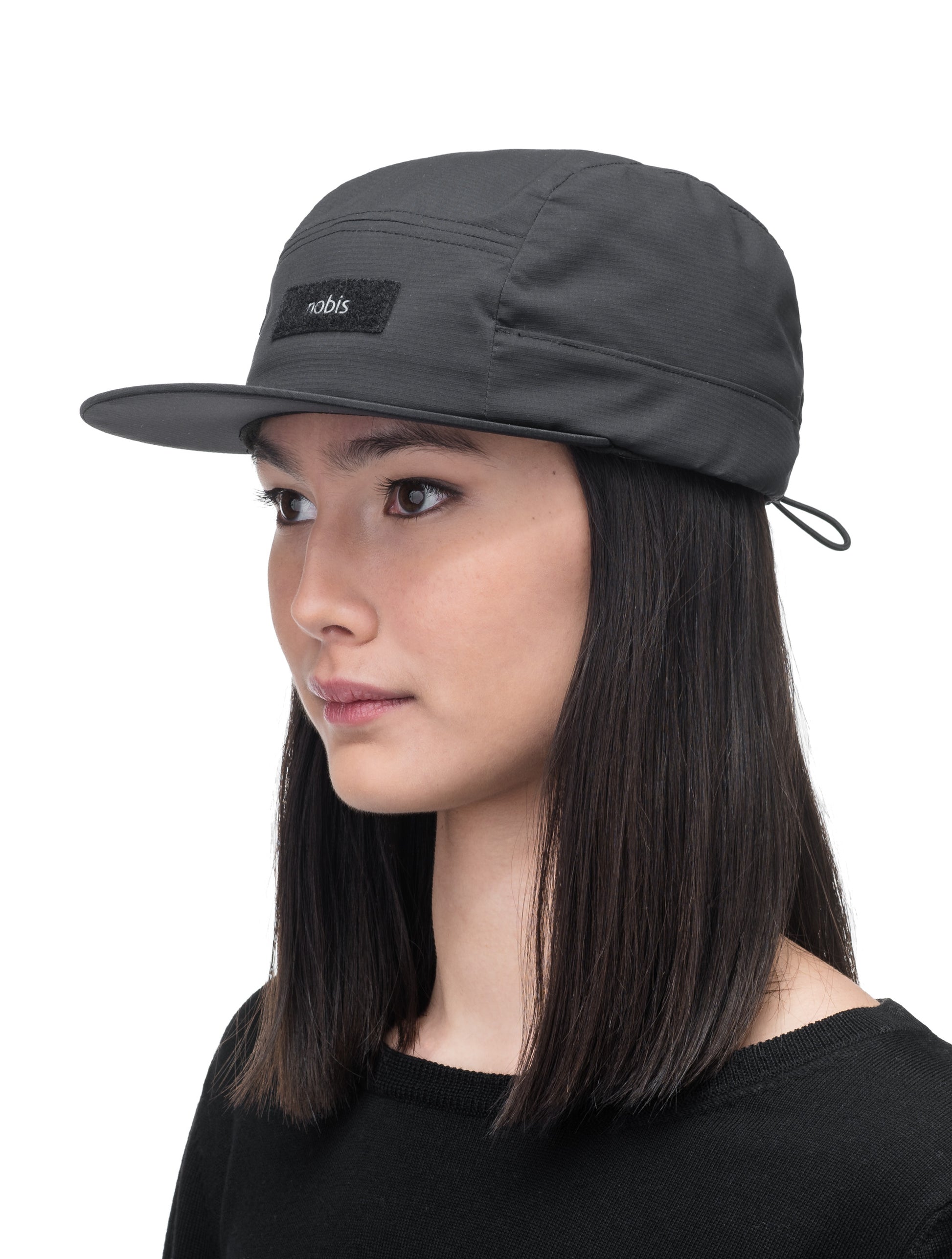 Myce Unisex Insulated Racer Cap with low unstructured crown, flat peak brim, and adjustable toggle back, in Black