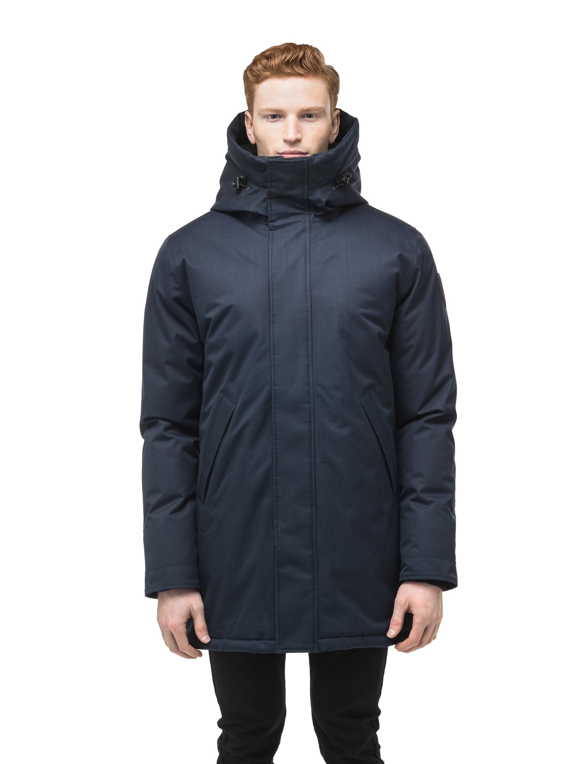Pierre Men's Jacket in thigh length, Canadian white duck down insulation, non-removable down-filled hood, angled waist pockets, centre-front zipper with wind flap, and elastic ribbed cuffs, in CH Navy