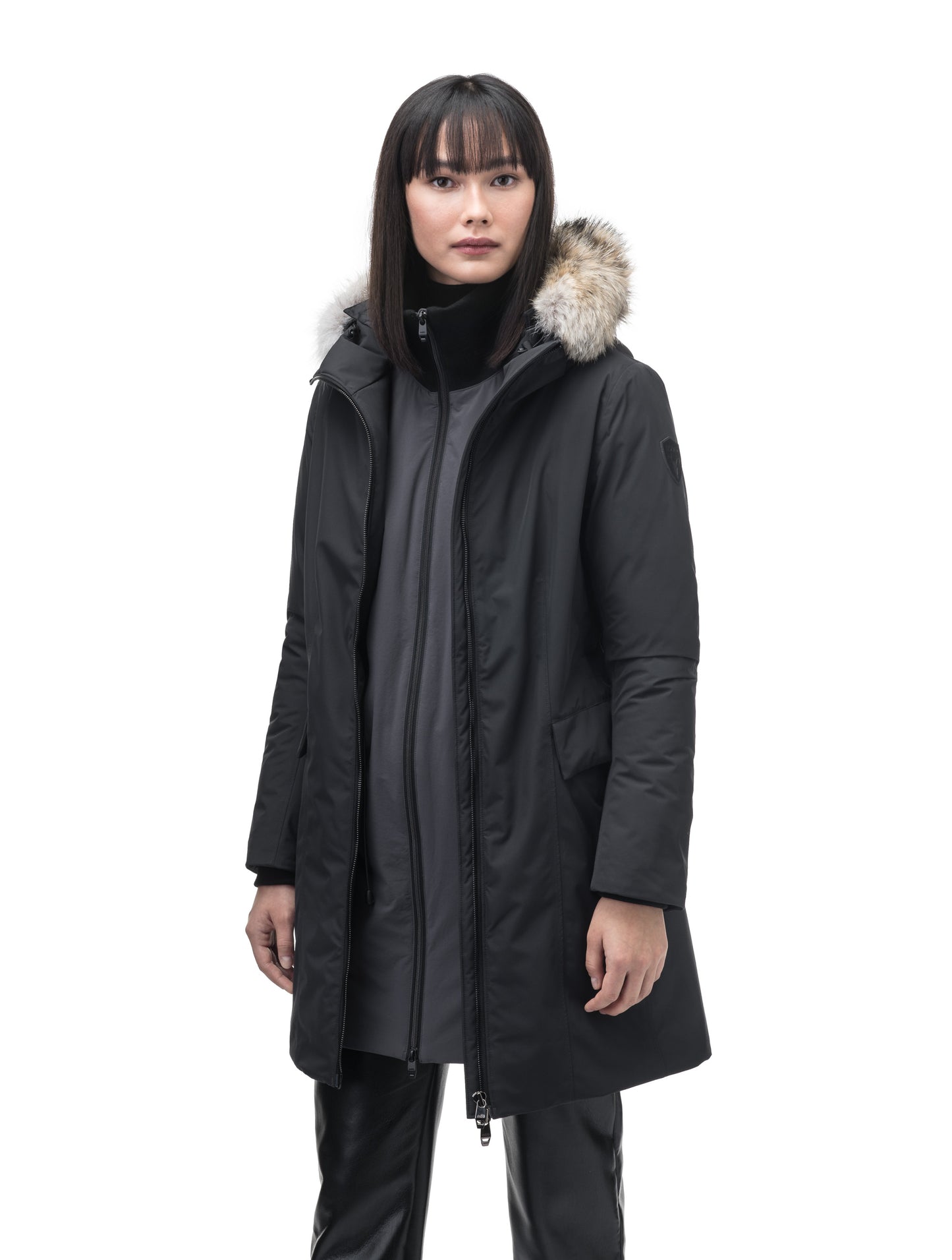 Romeda Ladies Mid Thigh Parka in thigh length, Canadian duck down insulation, non-removable hood with removable fur ruff trim, and two-way front zipper, in Black