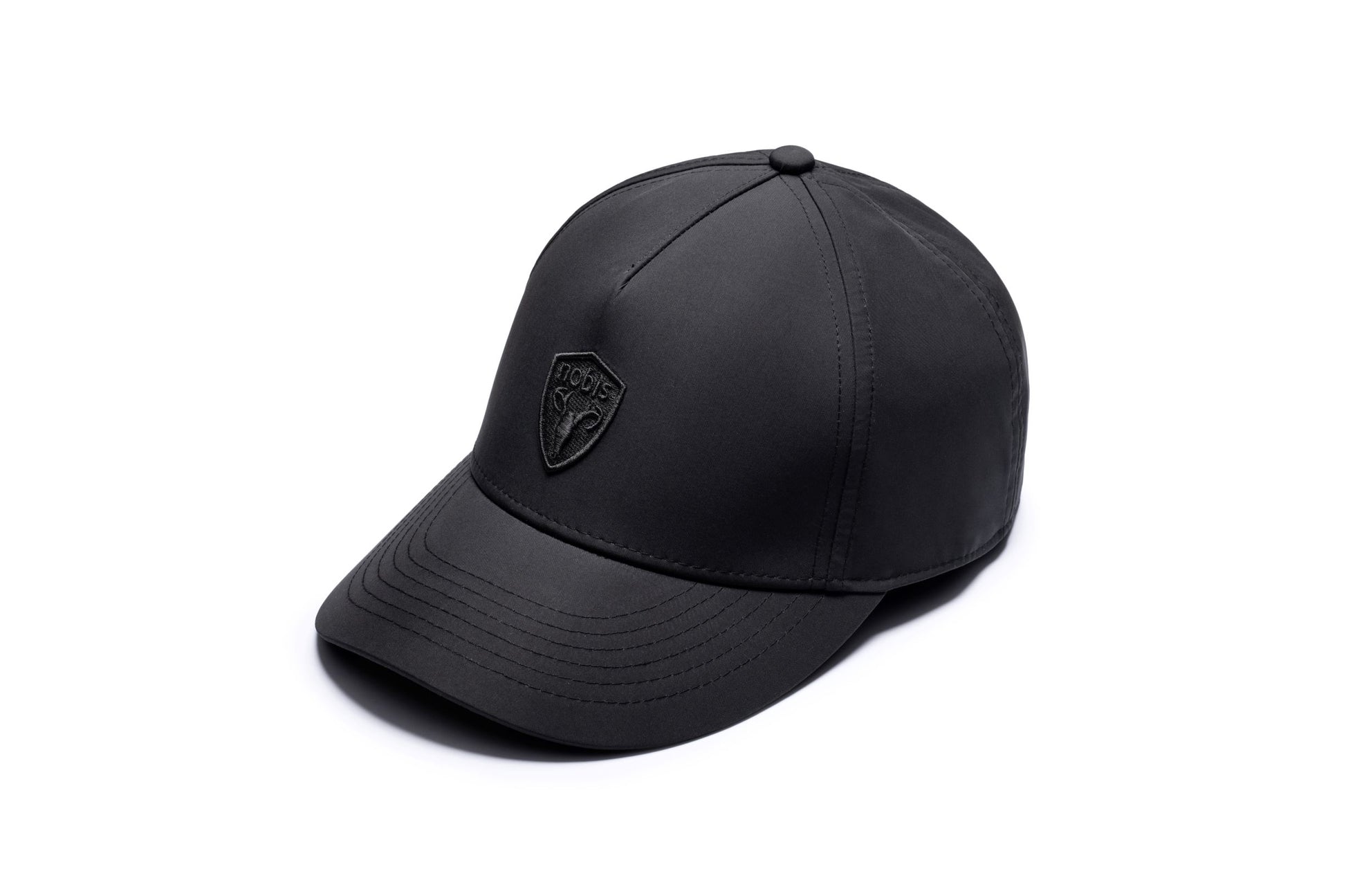 Satine Adjustable Cap in 5-panel construction, mid height crown, curved peak brim, and adjustable strap closure, in Black