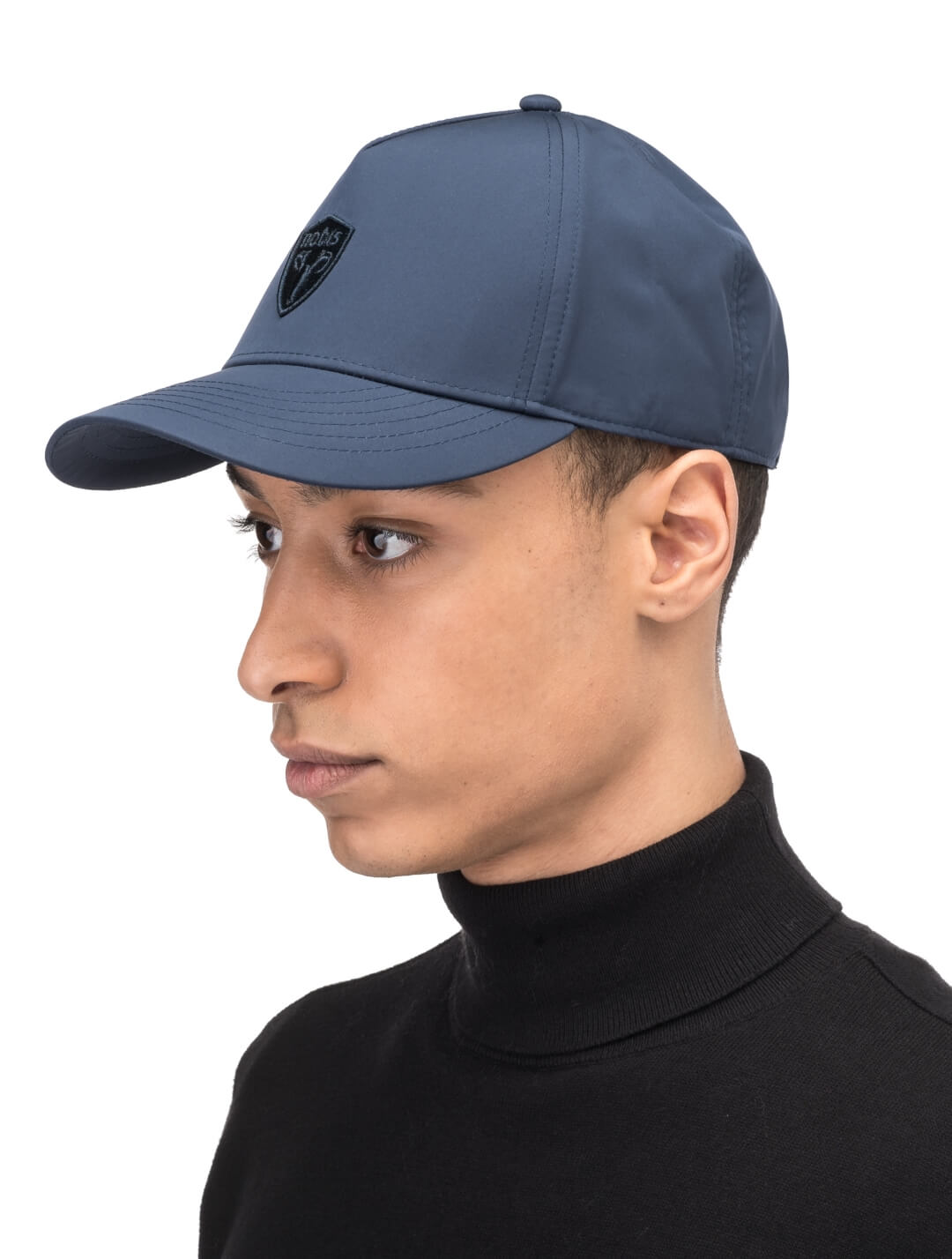 Satine Adjustable Cap in 5-panel construction, mid height crown, curved peak brim, and adjustable strap closure, in Marine