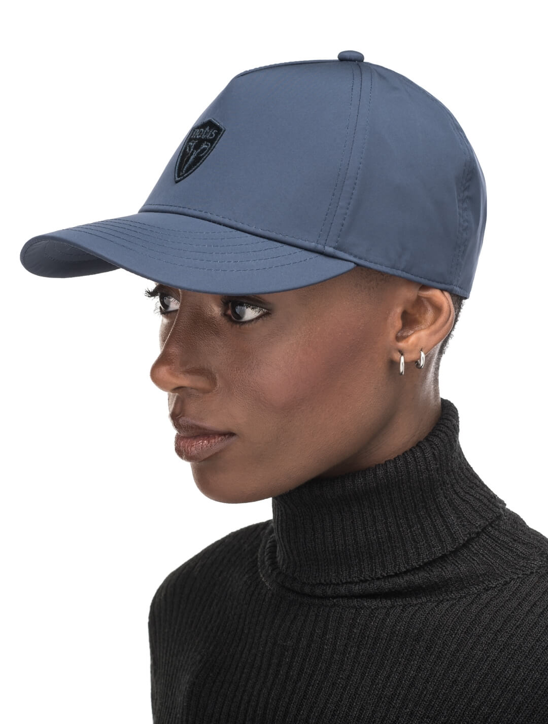 Satine Adjustable Cap in 5-panel construction, mid height crown, curved peak brim, and adjustable strap closure, in Marine