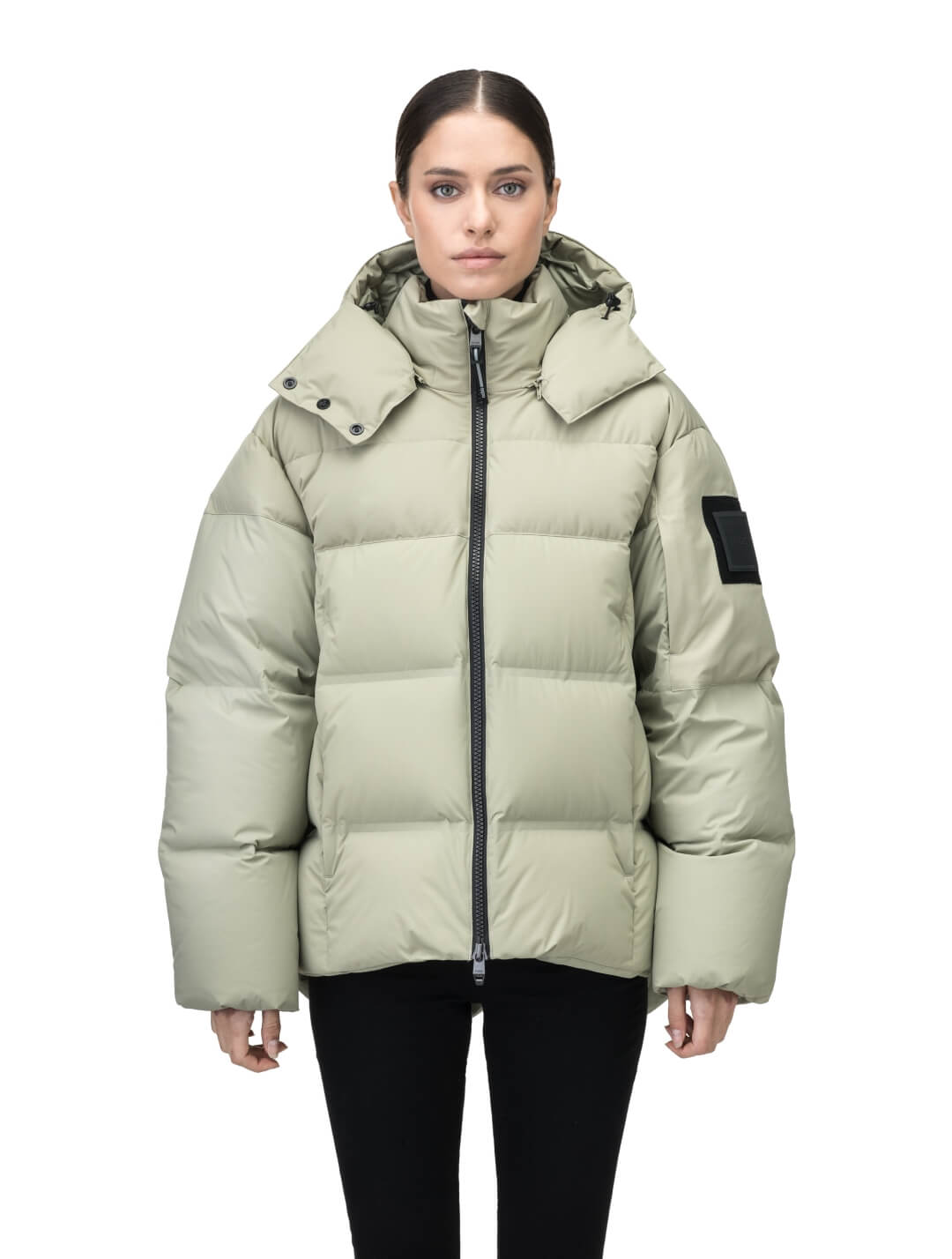 Una Ladies Performance Puffer in hip length, Technical Taffeta and Durable Stretch Ripstop fabrication, Premium Canadian White Duck Down insulation, removable down filled hood, centre front two-way zipper, and side-entry pockets at waist, in Tea